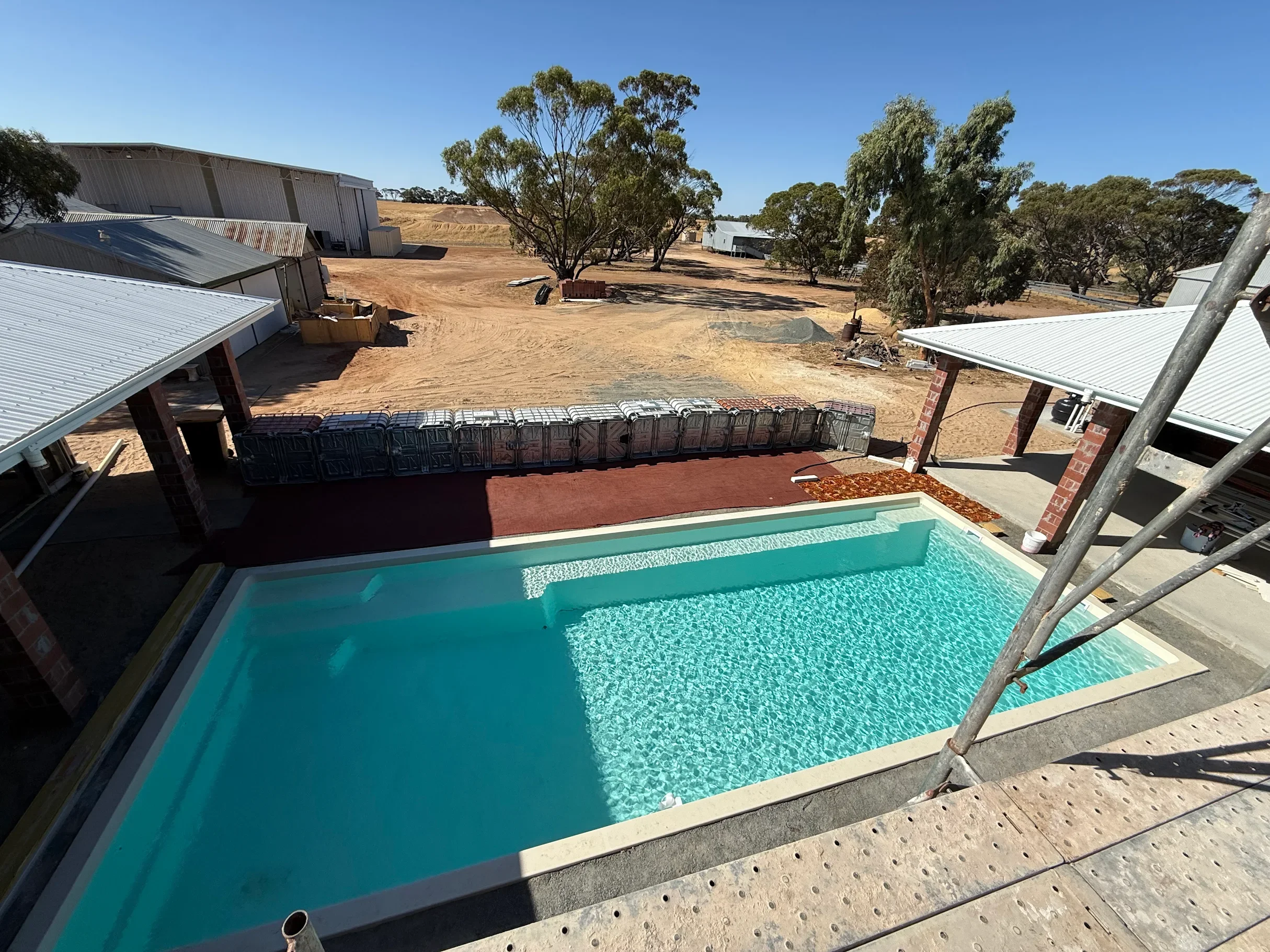 Pool Install in the middle of an alfresco area on this modern farm house renovation. 