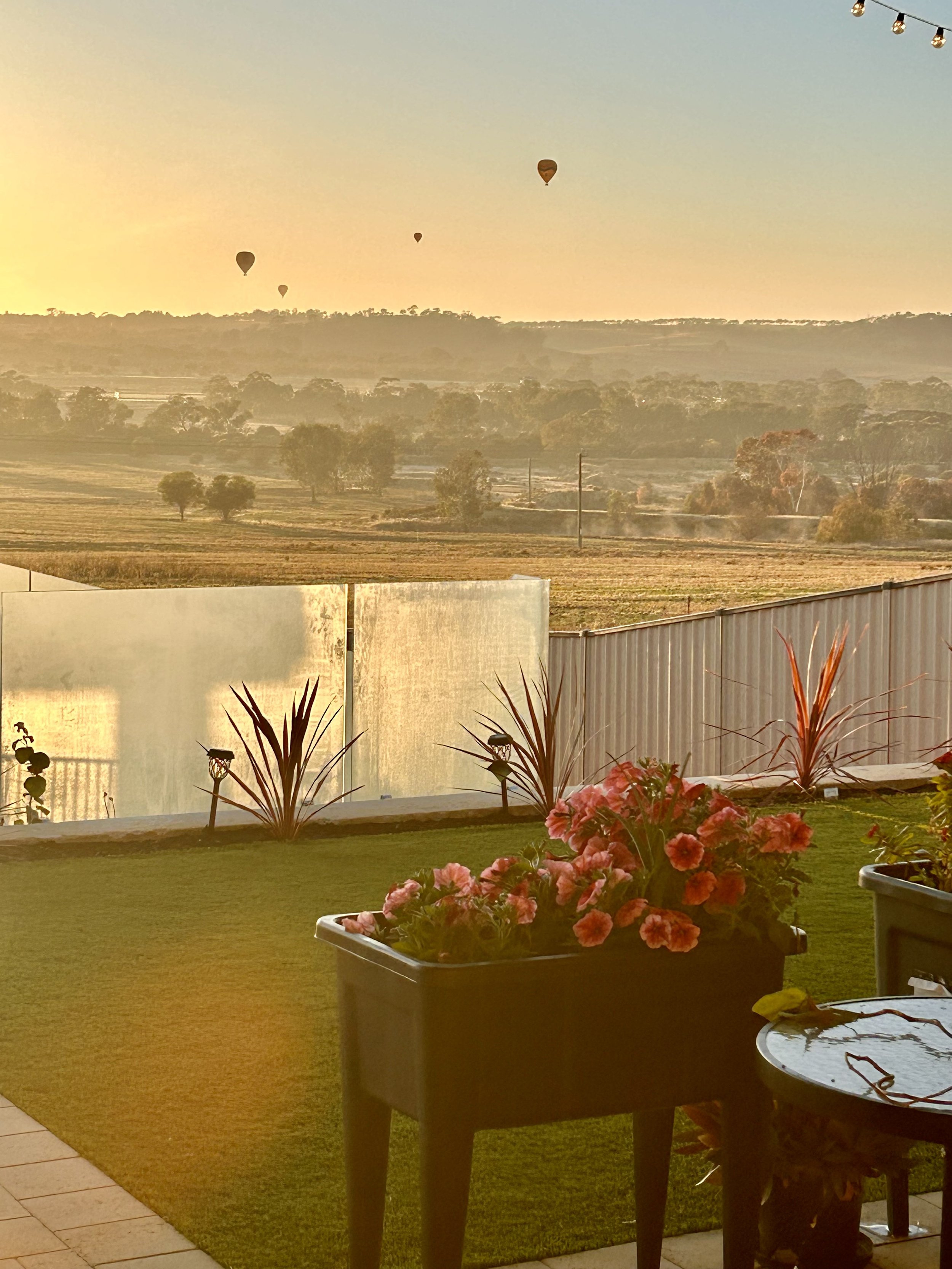 Fibreglass pool at sunrise with hot air balloon over the Avon Valley WA