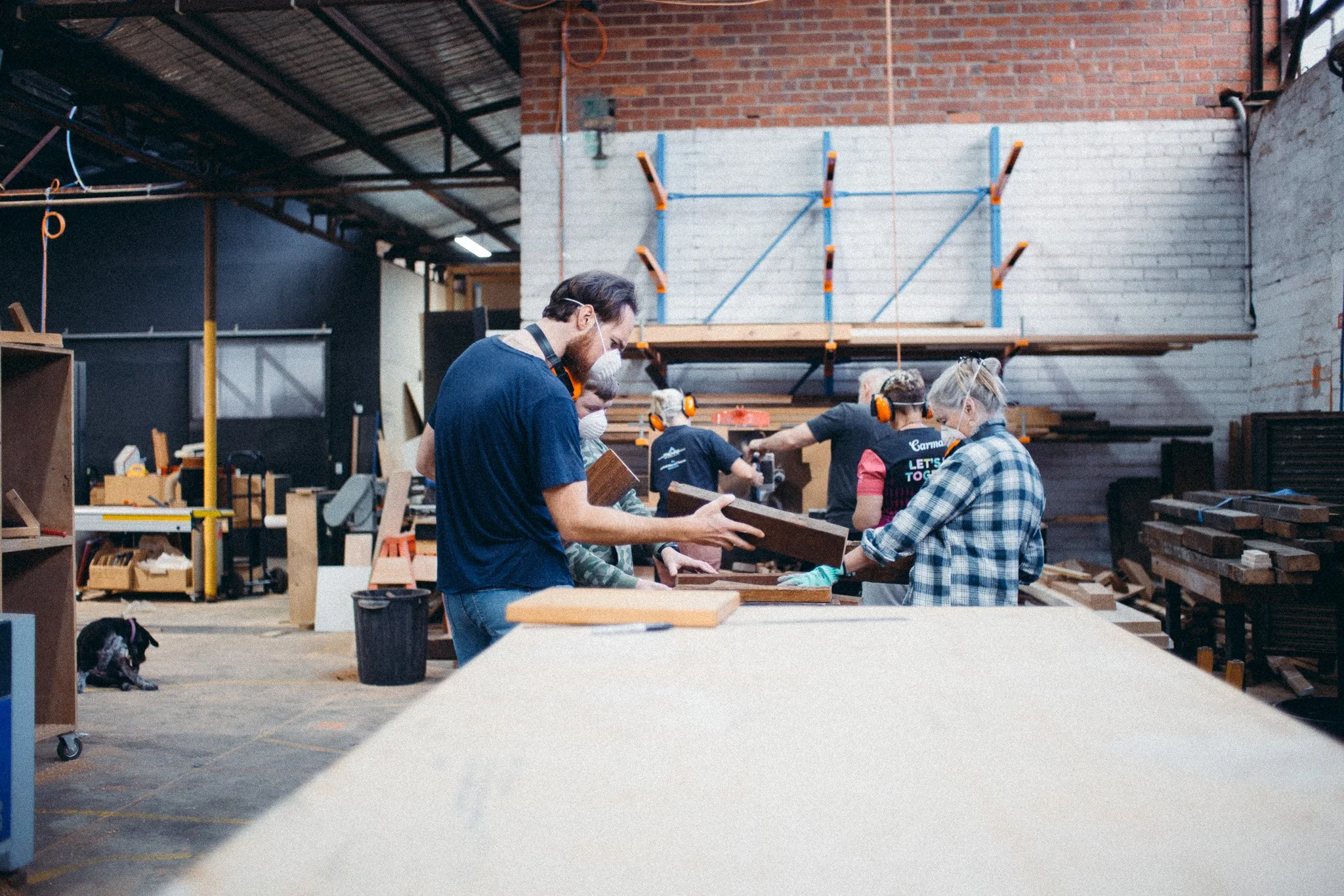 Instructor explaining woodworking techniques to a small class in Melbourne