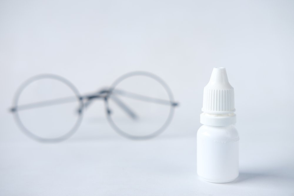 White plastic dropper bottle with white plastic cap