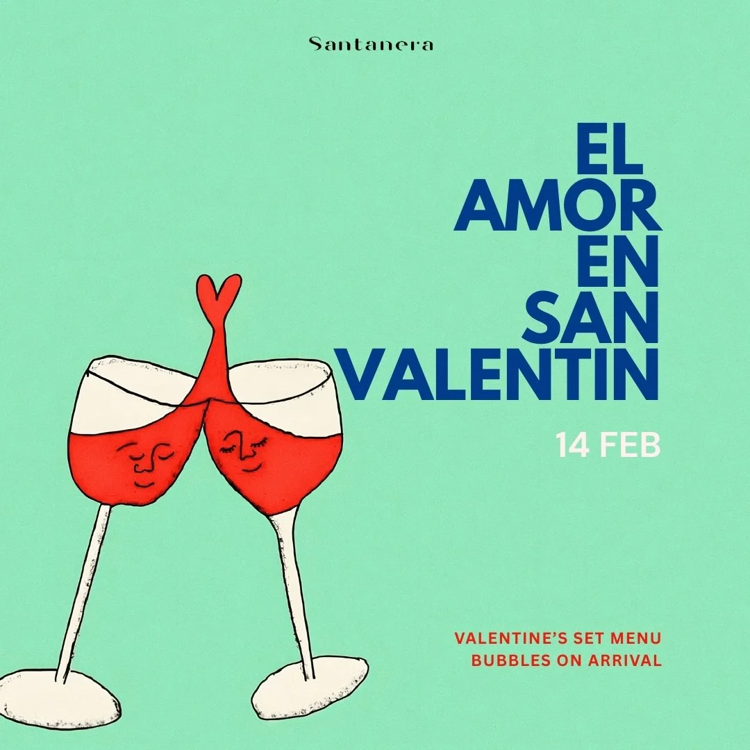 Valentine's Day promotional poster with two wine glasses with happy faces, clinking each other, with bubbles inside, on a green background. Text says 'El Amor en San Valentín,' February 14, and mentions a Valentine's set menu with bubbles on arrival.