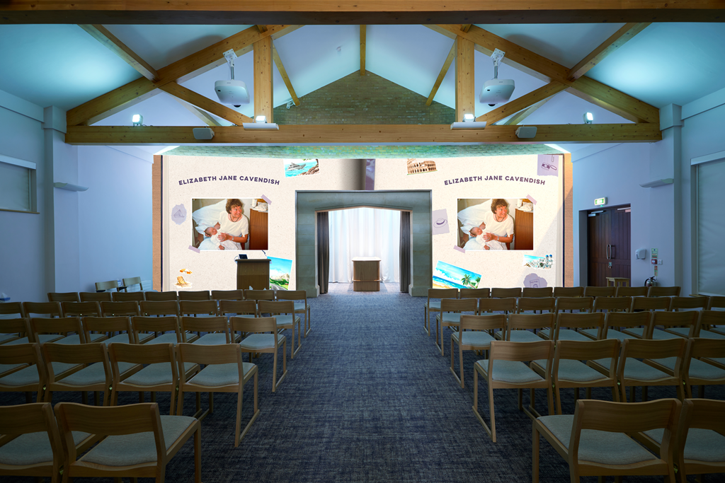 Conference room with chairs facing a stage featuring large screens displaying photos of a woman with a baby, titled Elizabeth Jane Cavendish.