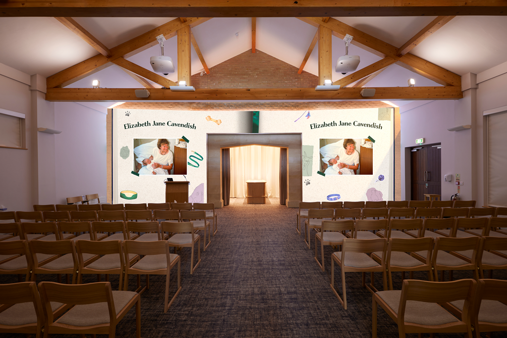 A conference room set up for a presentation with a large screen displaying the name Elizabeth Jane Cavendish and photos of a woman holding a baby, decorated with playful pastel illustrations.