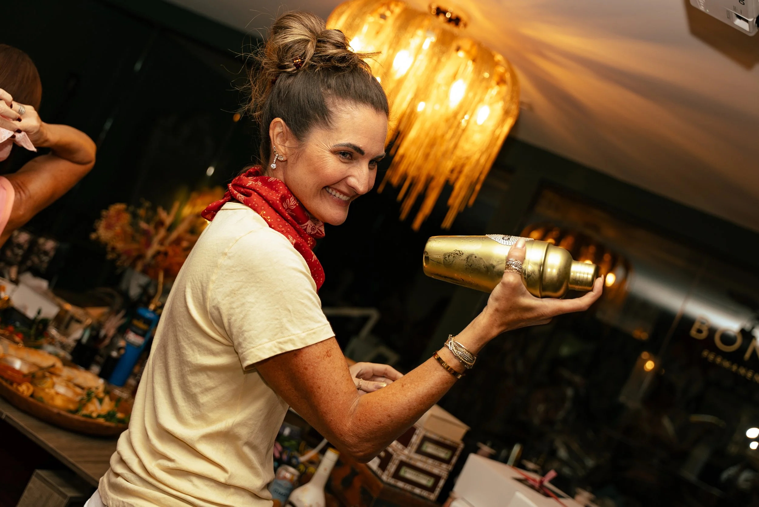 Heels & Handshakes member enjoying a cocktail-making experience at a Nashville members-only event