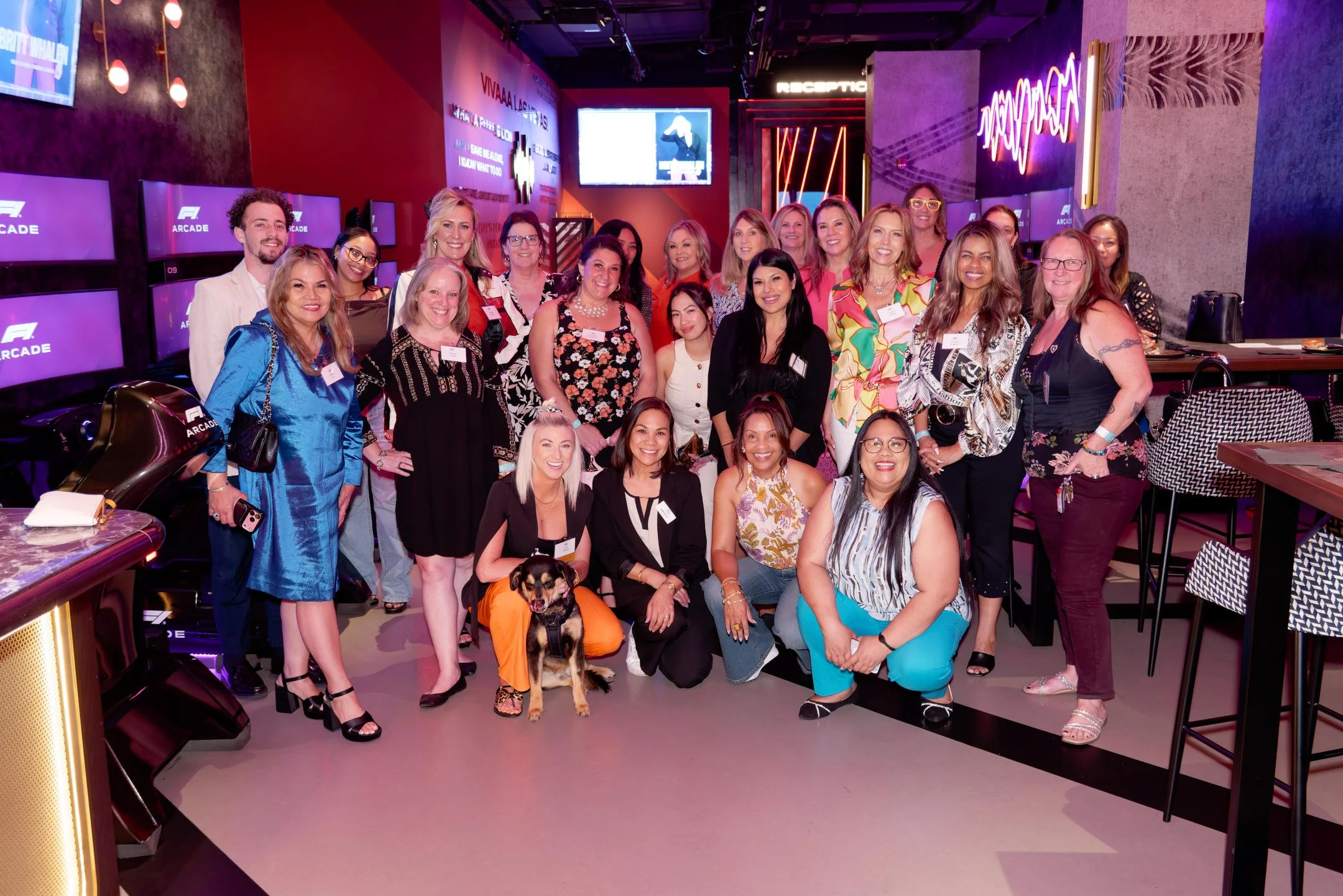 Group photo of women in business and professional women attending the Heels & Handshakes Las Vegas networking event at F1 Arcade Las Vegas.