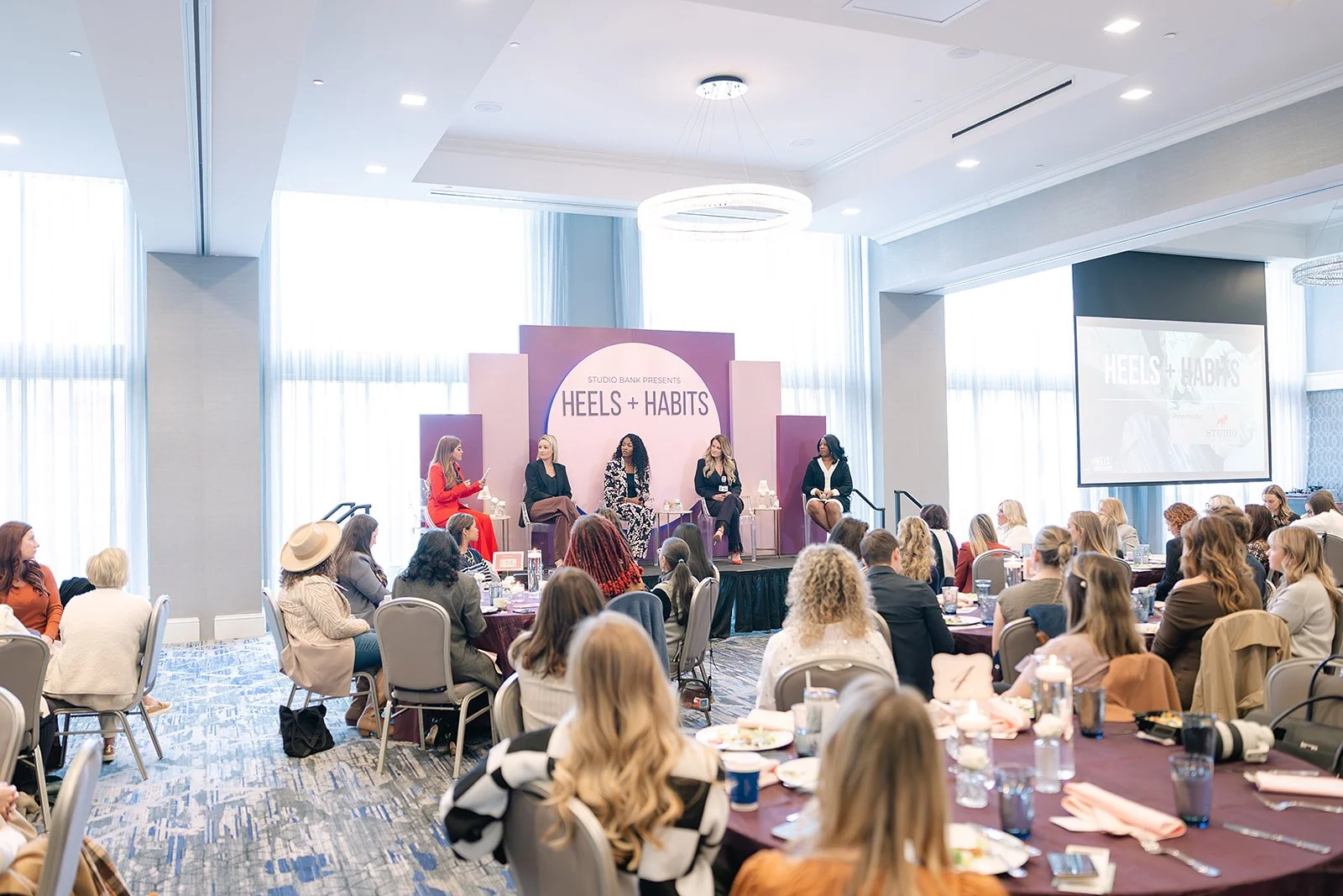Attendees listening to a panel discussion during the Heels + Habits event hosted by Heels & Handshakes in Nashville.