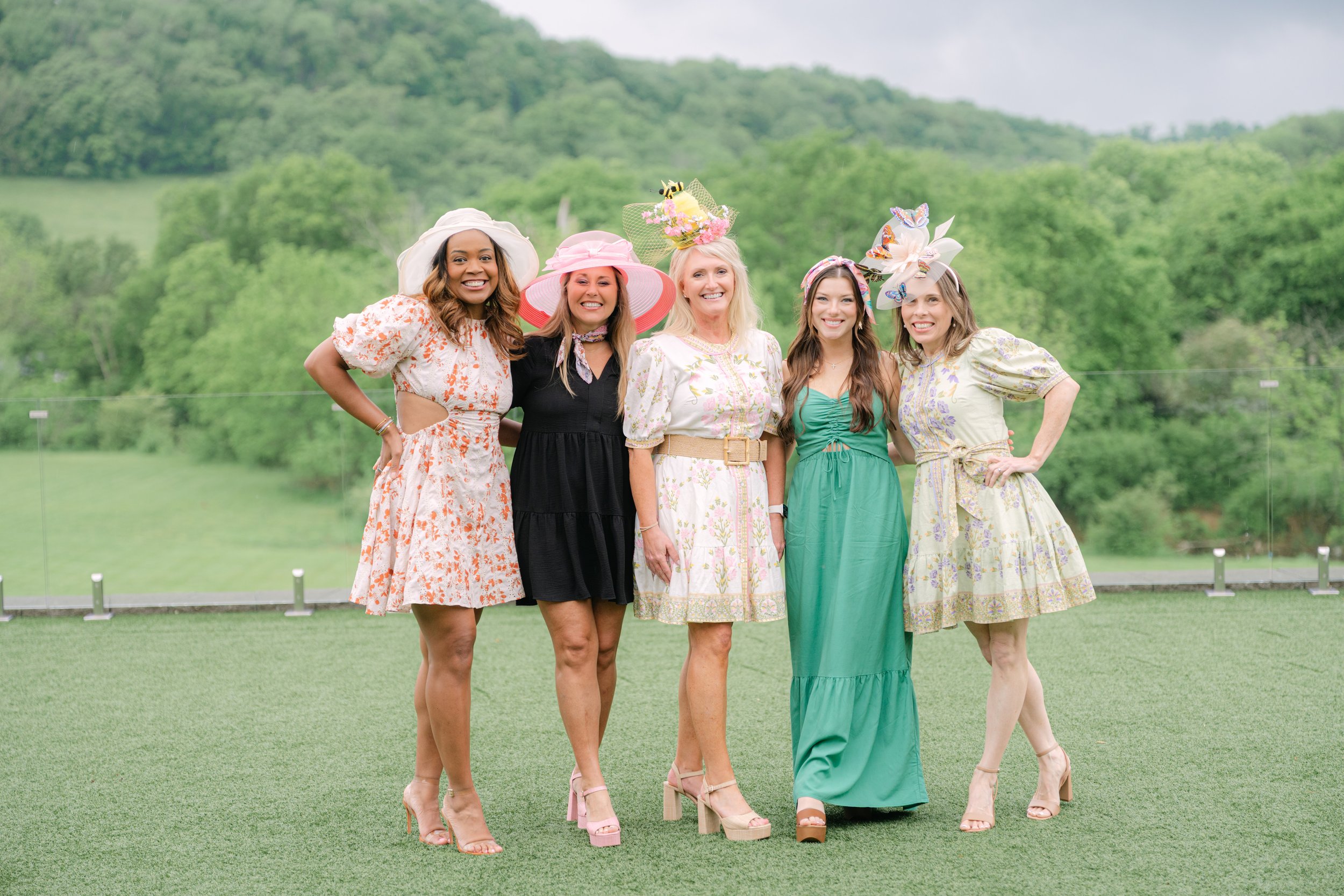 Five women posing together outdoors at a Heels & Handshakes networking event in Nashville, Tennessee.