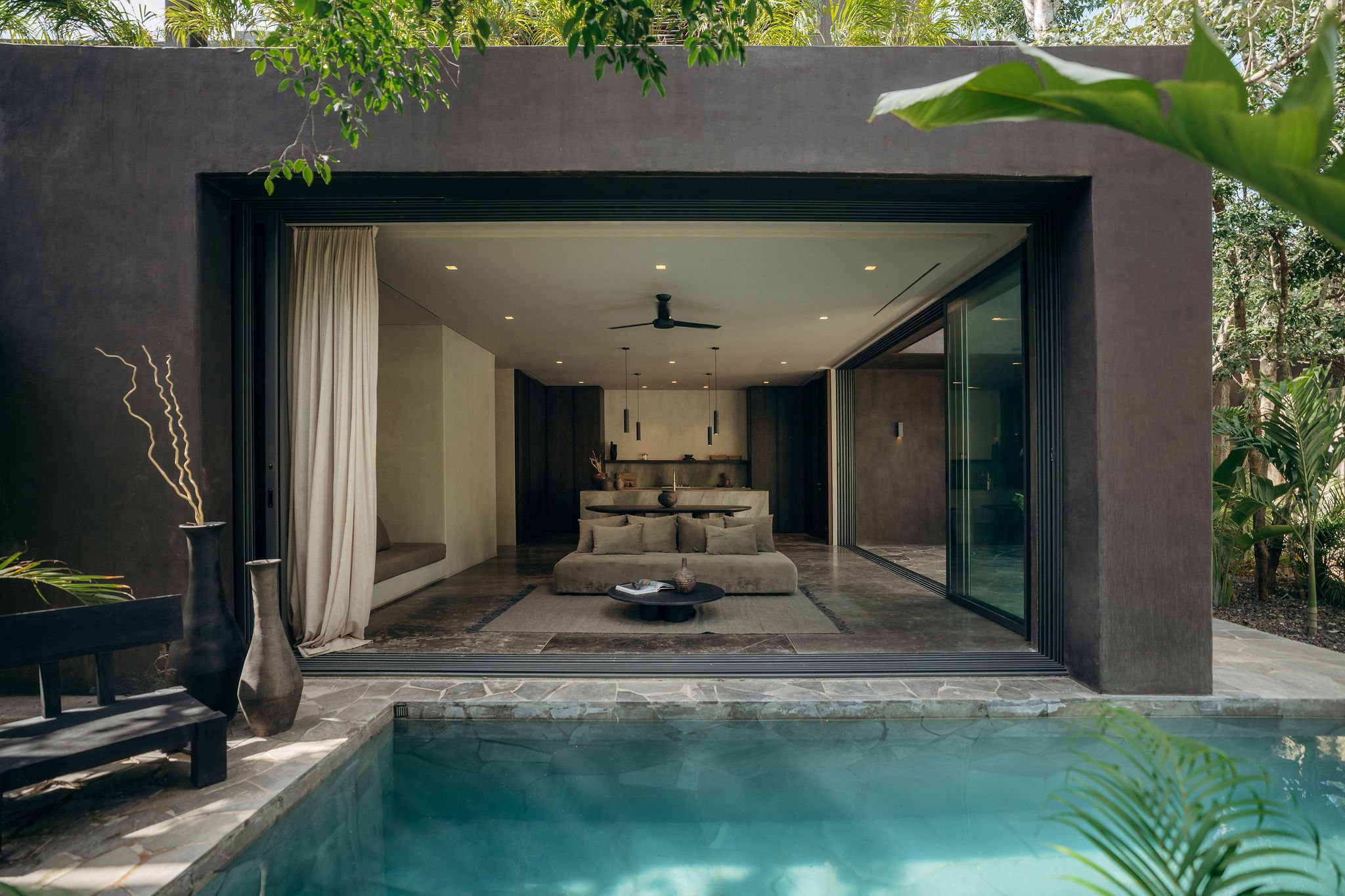 La Reserva interiors opening onto private pool and jungle