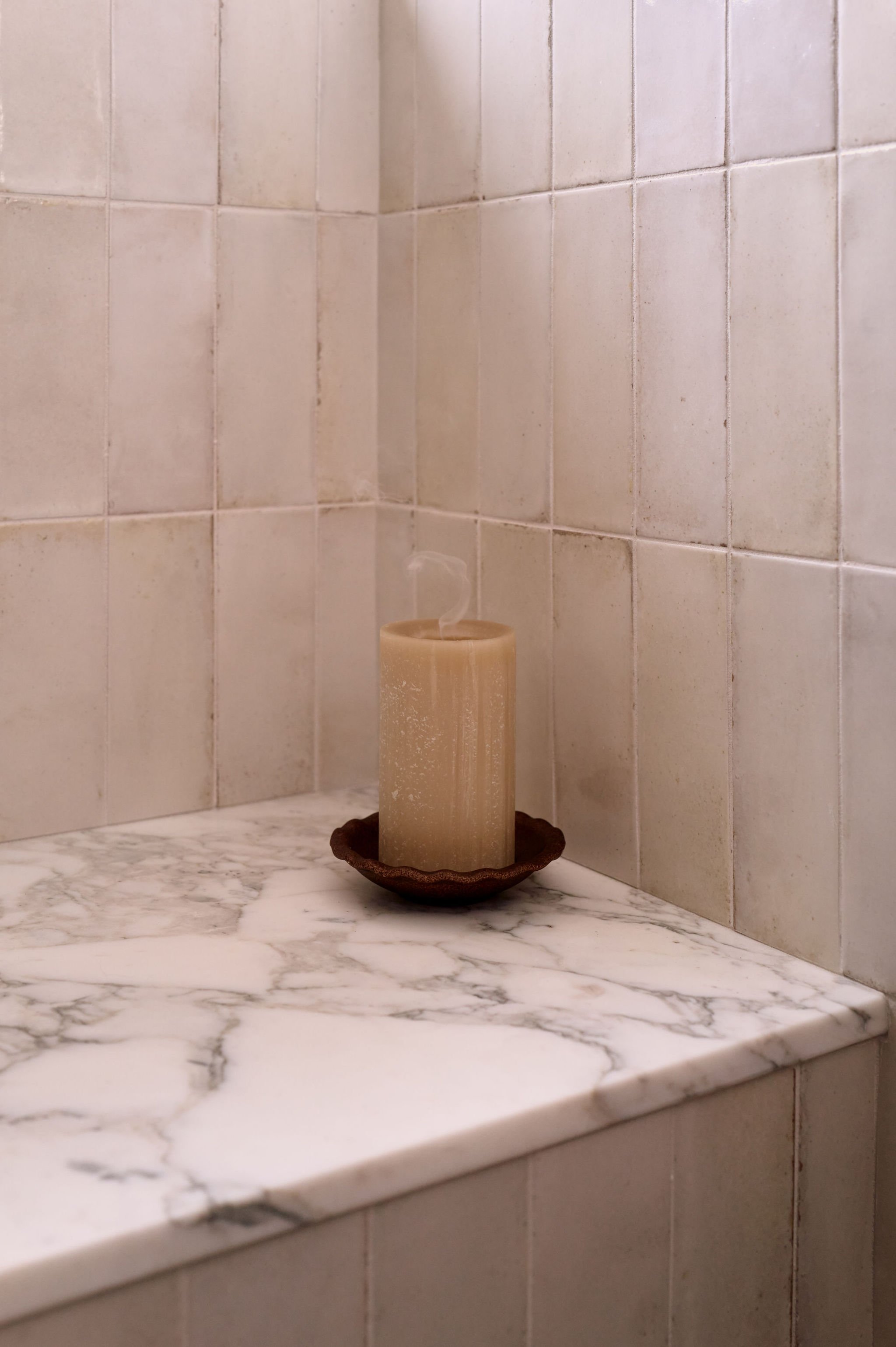tahoe-cottage-bathroom-marble-shower-bench-detail-mia-sandmark-design.jpg