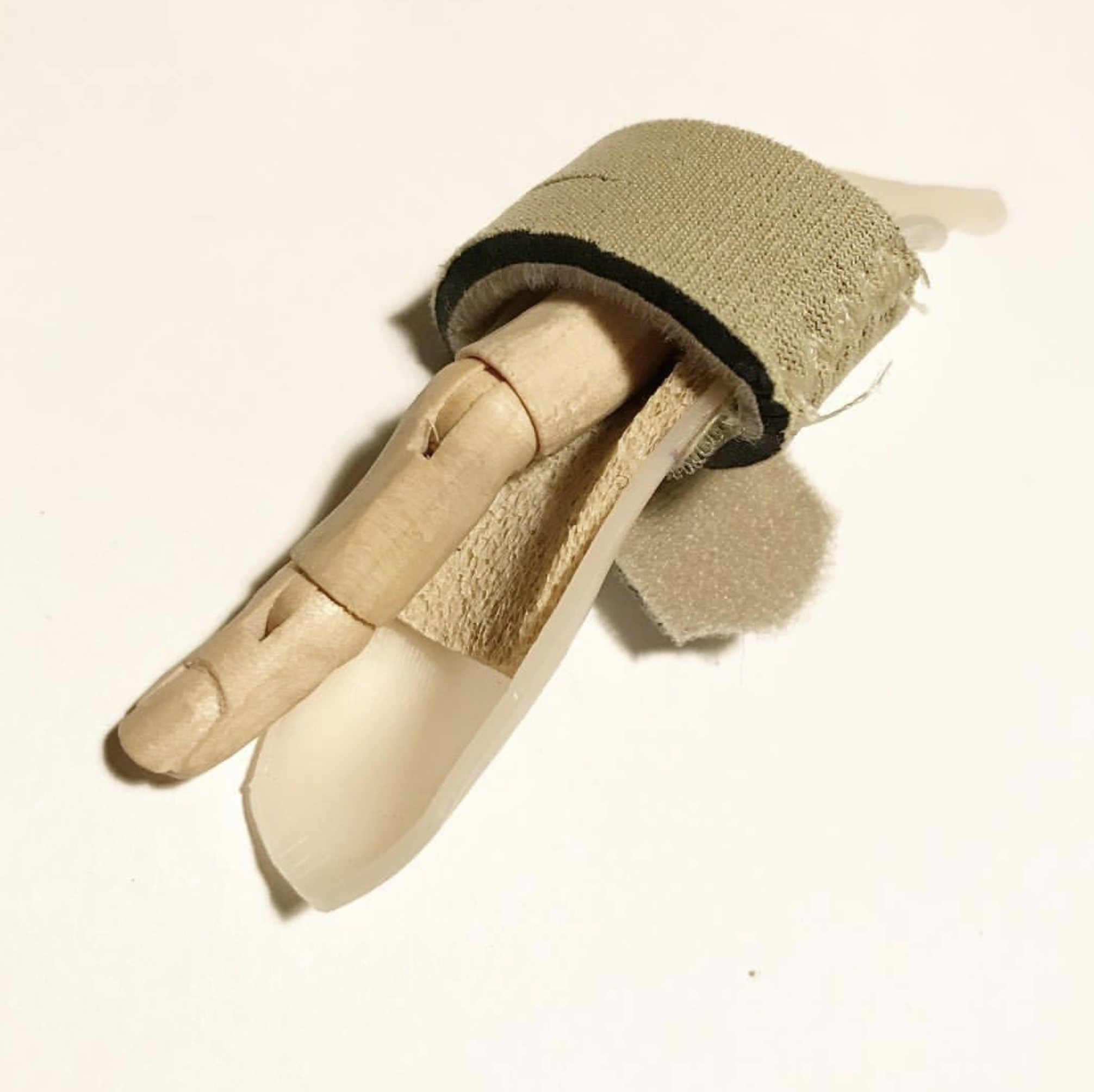 I keep my feathers numbered for just an occasion : Maple, medical thermal plastic, bandage : 2019