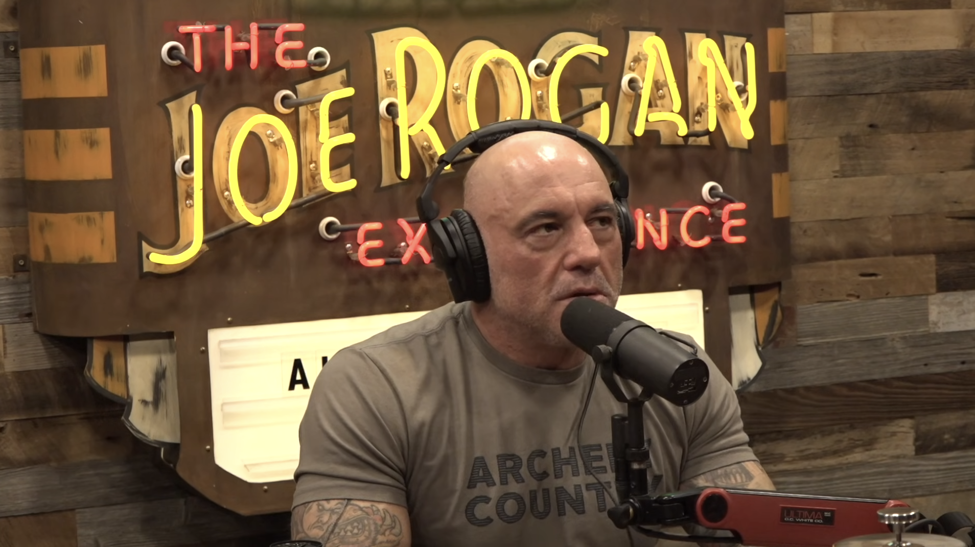 photo of joe rogan using a shure sm7b to record a podcast