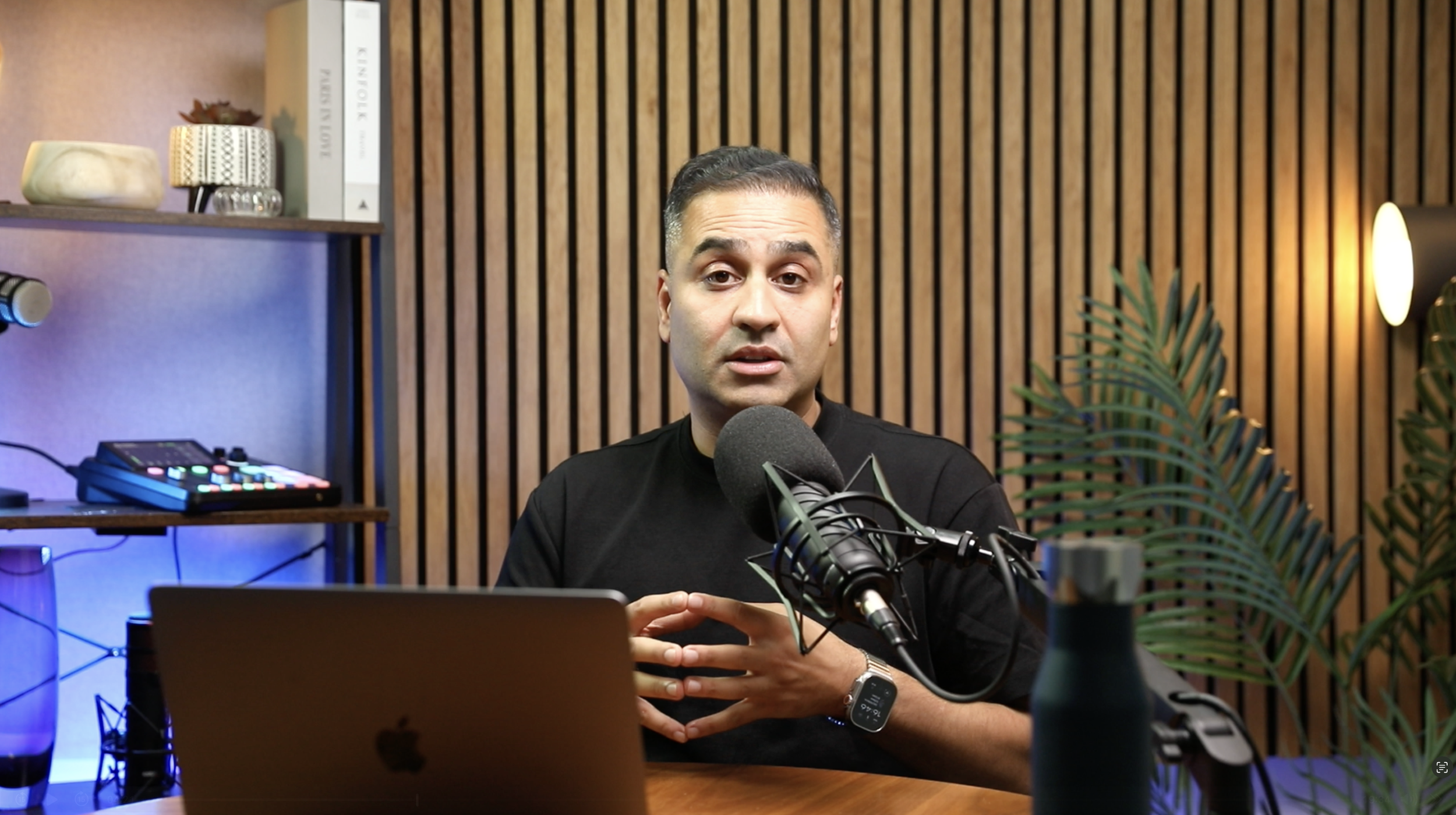 asian man recording a podcast in glasgow