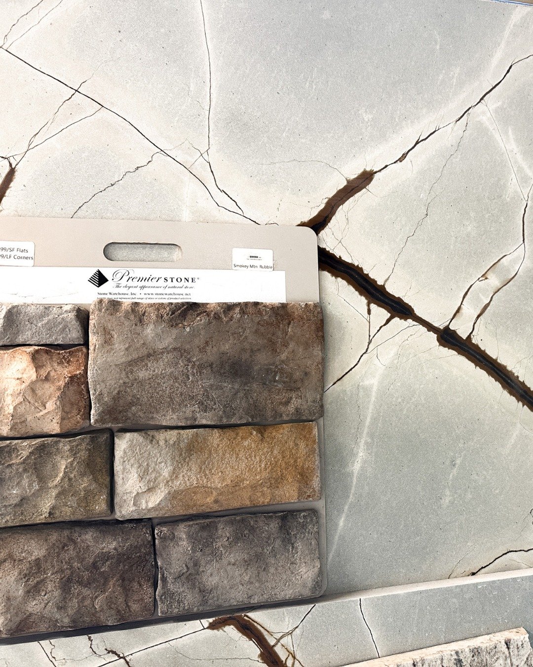 The world does design online and with AI, but Brit likes to see things in person as much as possible. This is the stone for a fireplace that has been selected so we take it with us to source stone countertops! Which one of these marble and quartzite 