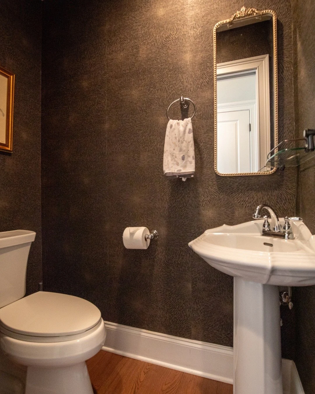Sneaking in little moments of luxury like the rich bathroom wallpaper in this tiny powder bath really help dress up a space. Or adding pretty accessories to a vanity top is lovely. We don’t need to only have it be functional. A little bit here
