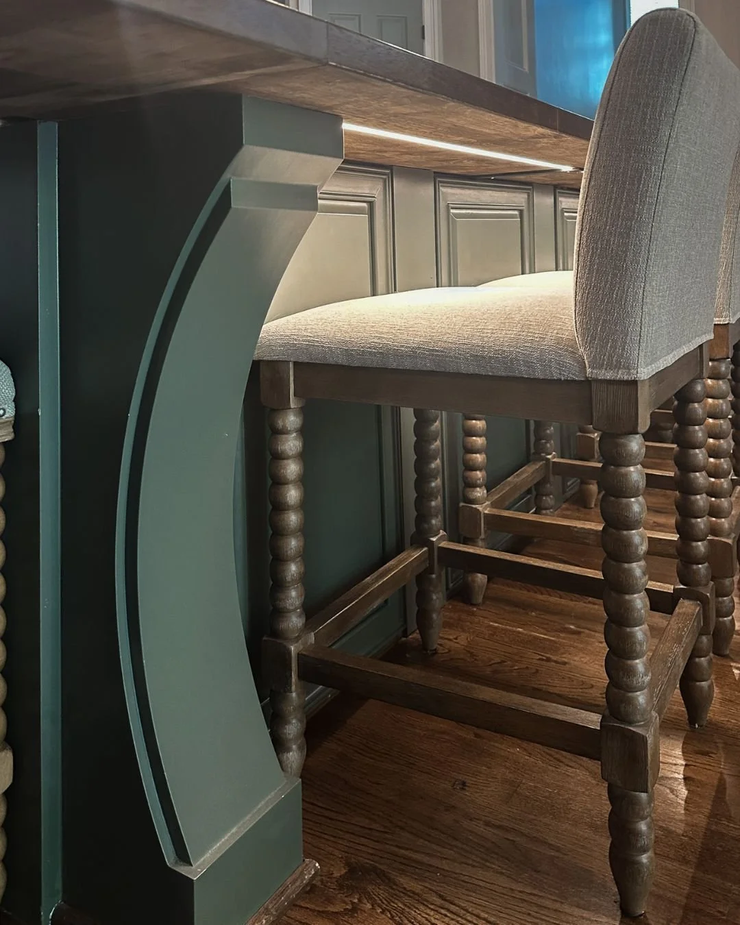 It’s the small details that elevate a space to feel truly custom!
In this case, the undercounter lighting highlights the architectural features of the island, adding depth and dimension to the kitchen’s design. When the overhead lights ar