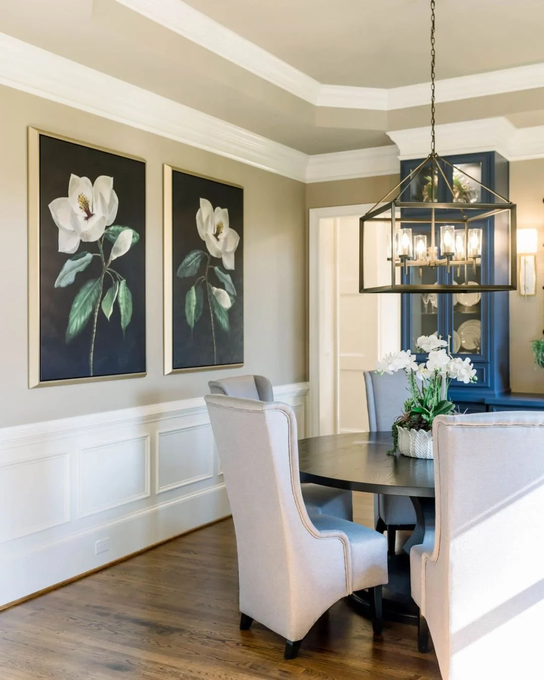 Is anything more quintessentially southern than artwork of magnolias blossoms? 
These paintings can create a focal point in this dining room that invites conversation and adds a layer of sophistication to the space. Whether your style leans towards t