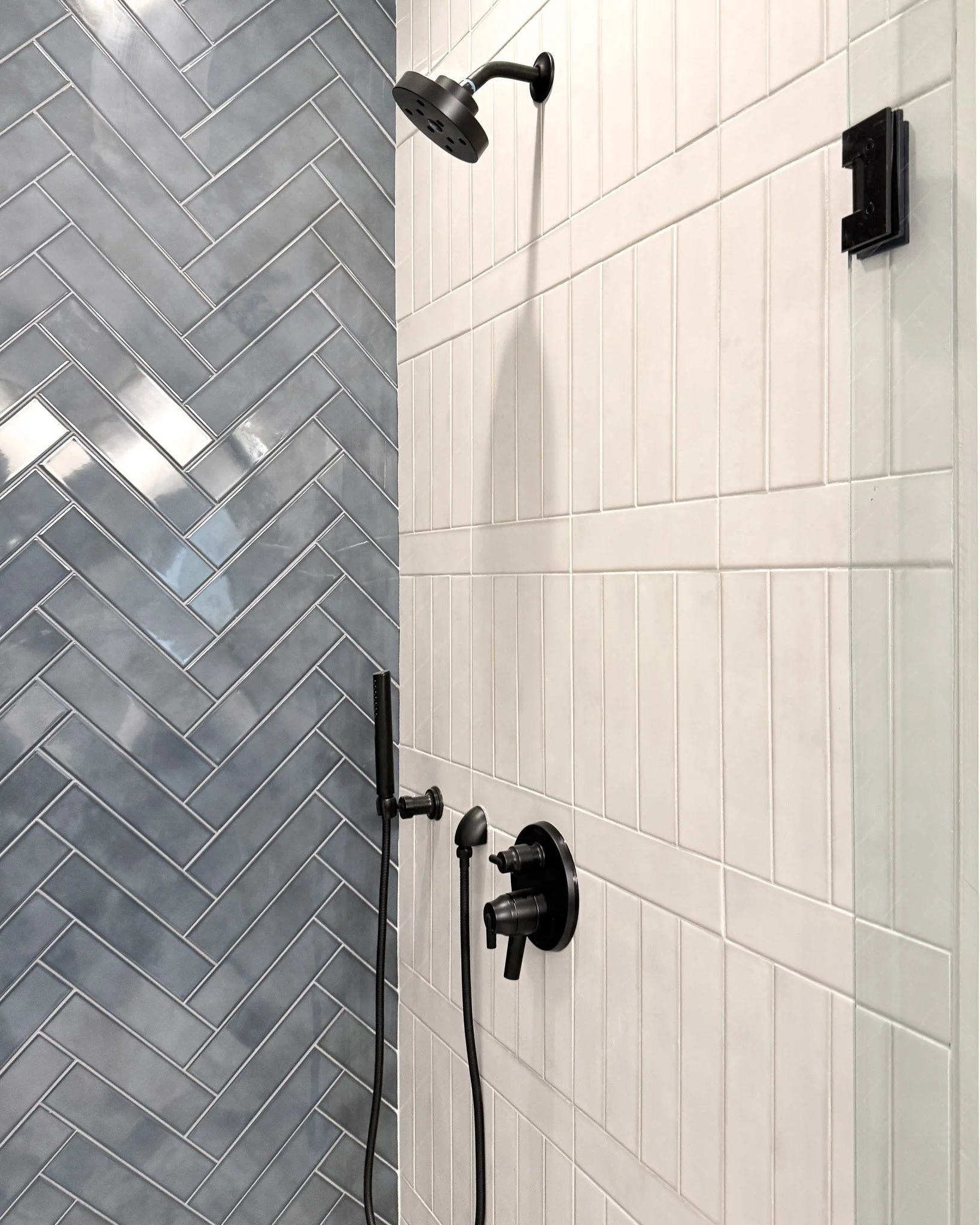 We promised we&rsquo;d share this bathroom, and here it is!
Masculine, dramatic, and a space definitely worth showing off. It&rsquo;s not weird to ask people if they want to see your bathroom when it&rsquo;s this beautiful! Working with this classic 