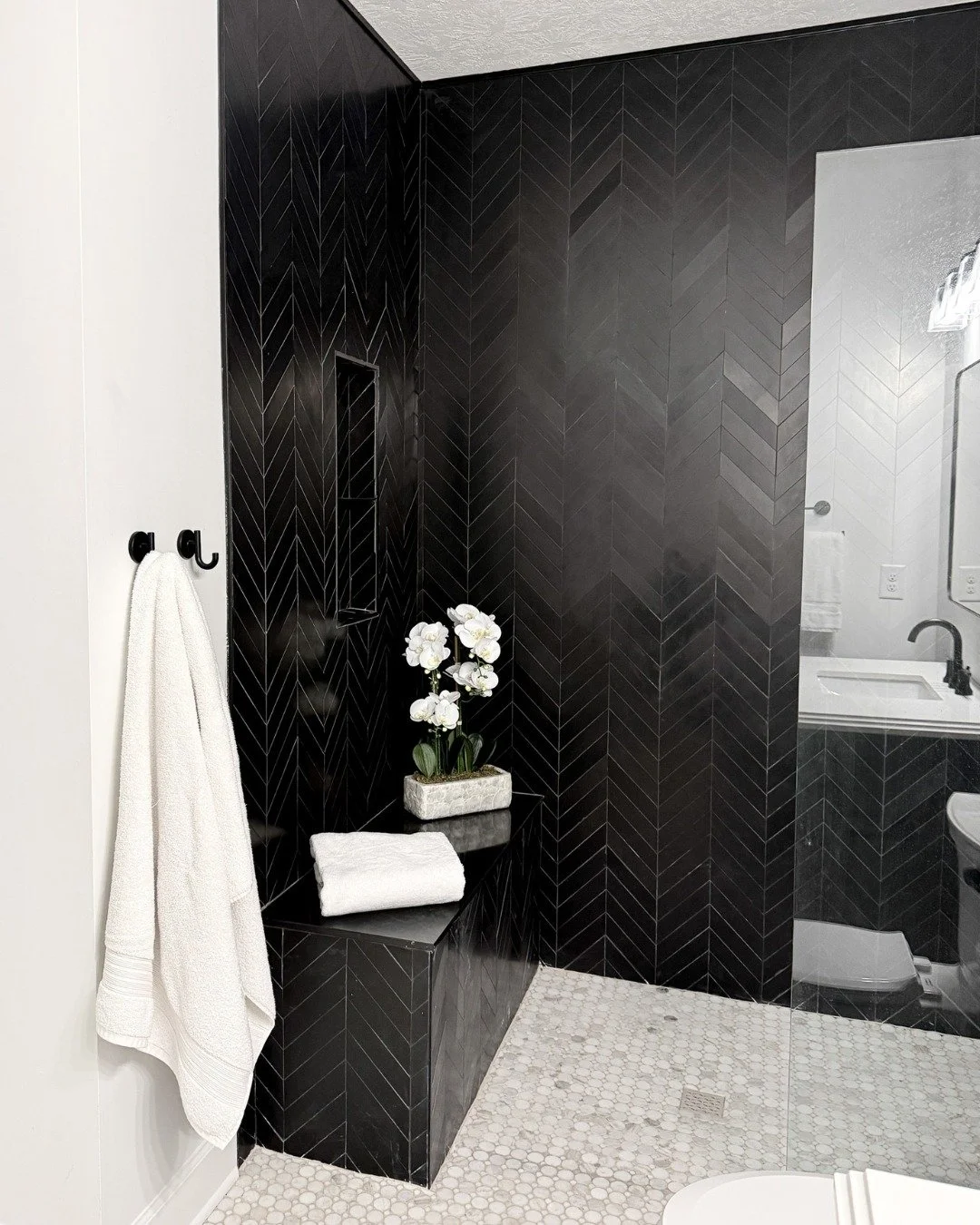 Remember the southern bachelor whose kitchen and primary bathroom we shared? We couldn&rsquo;t finish that home without sharing his guest bathroom transformation as well! The stars of the show here? The new tile in the graphic black and white, and th