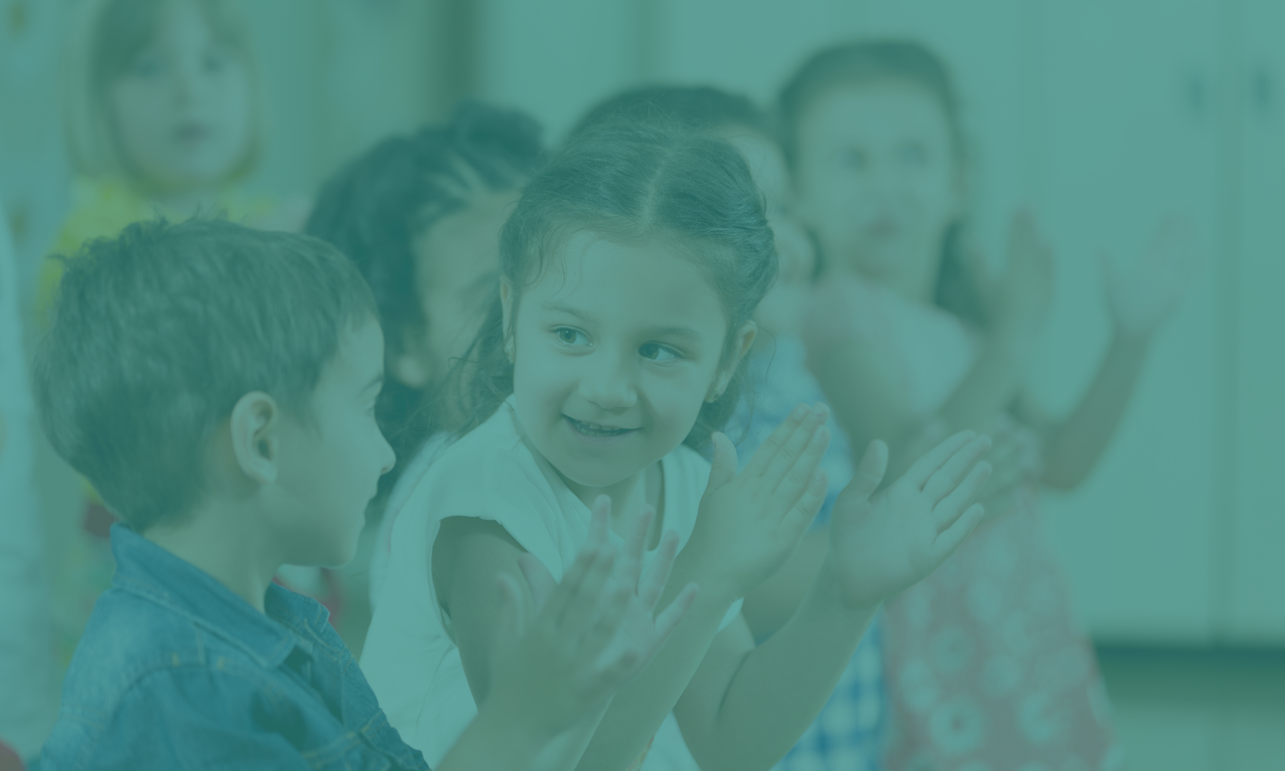 Picture of a group of kids clapping and dancing.