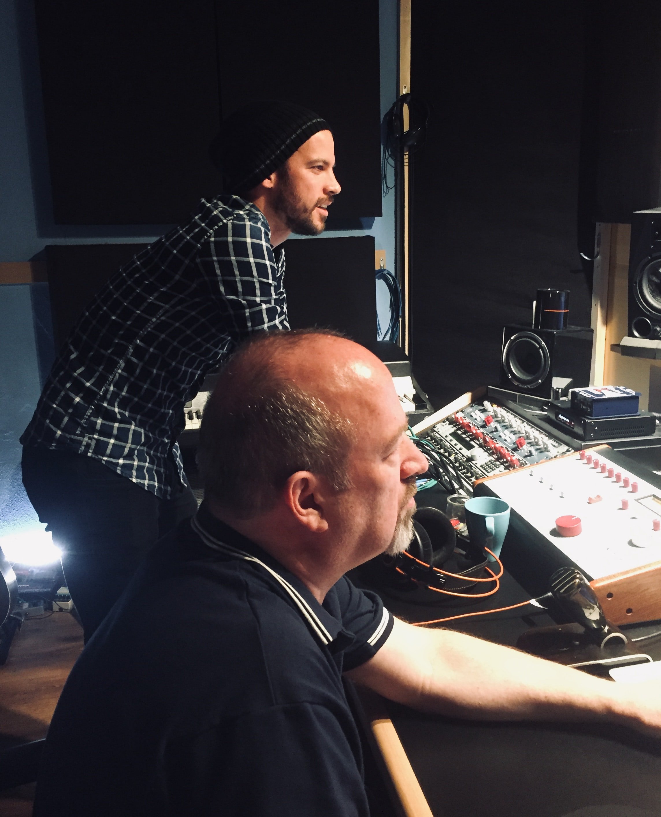 Listening back to the mix on the studio monitors