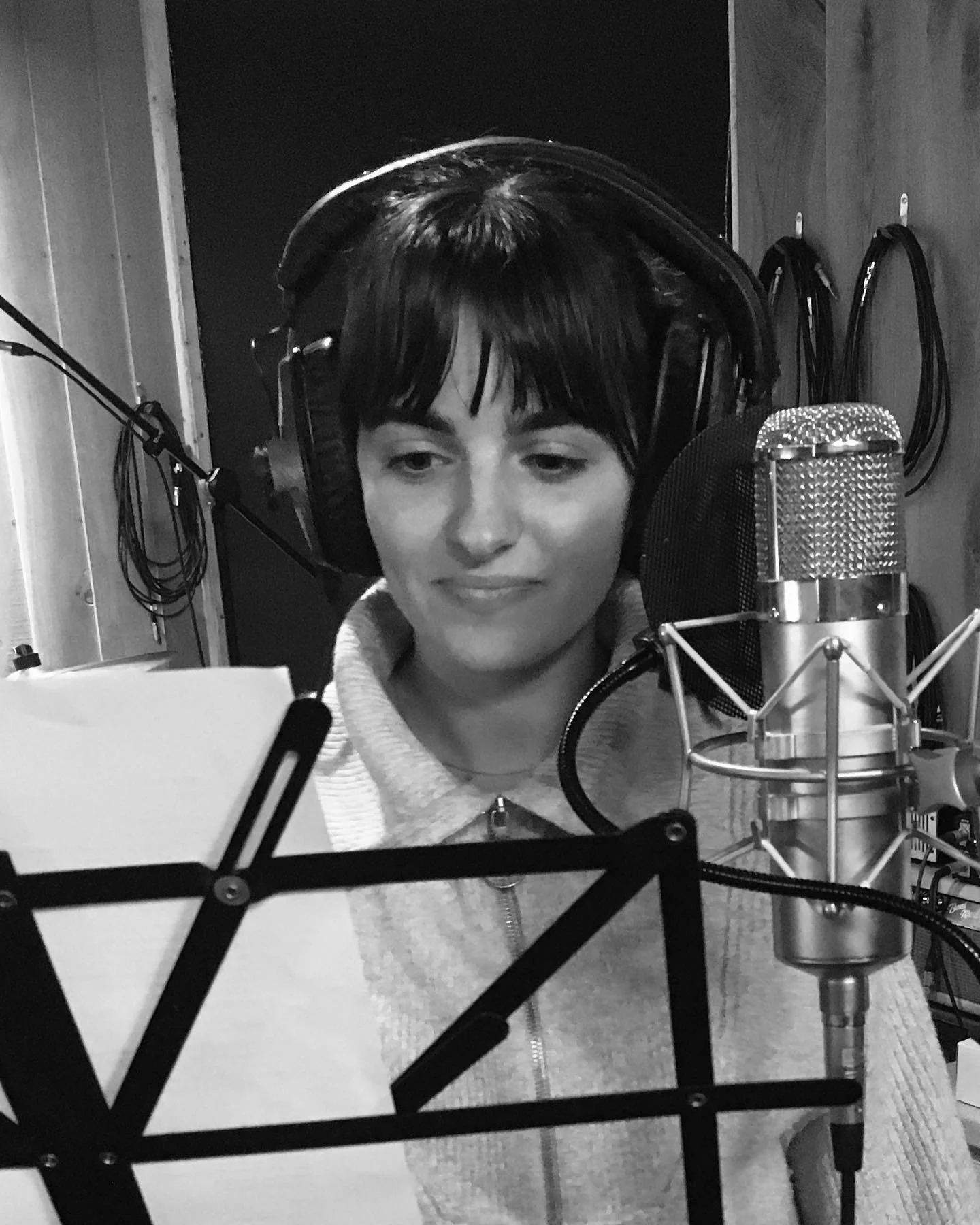 Alina recording vocals on a Stam SA-47 microphone at Soundcaster Studios