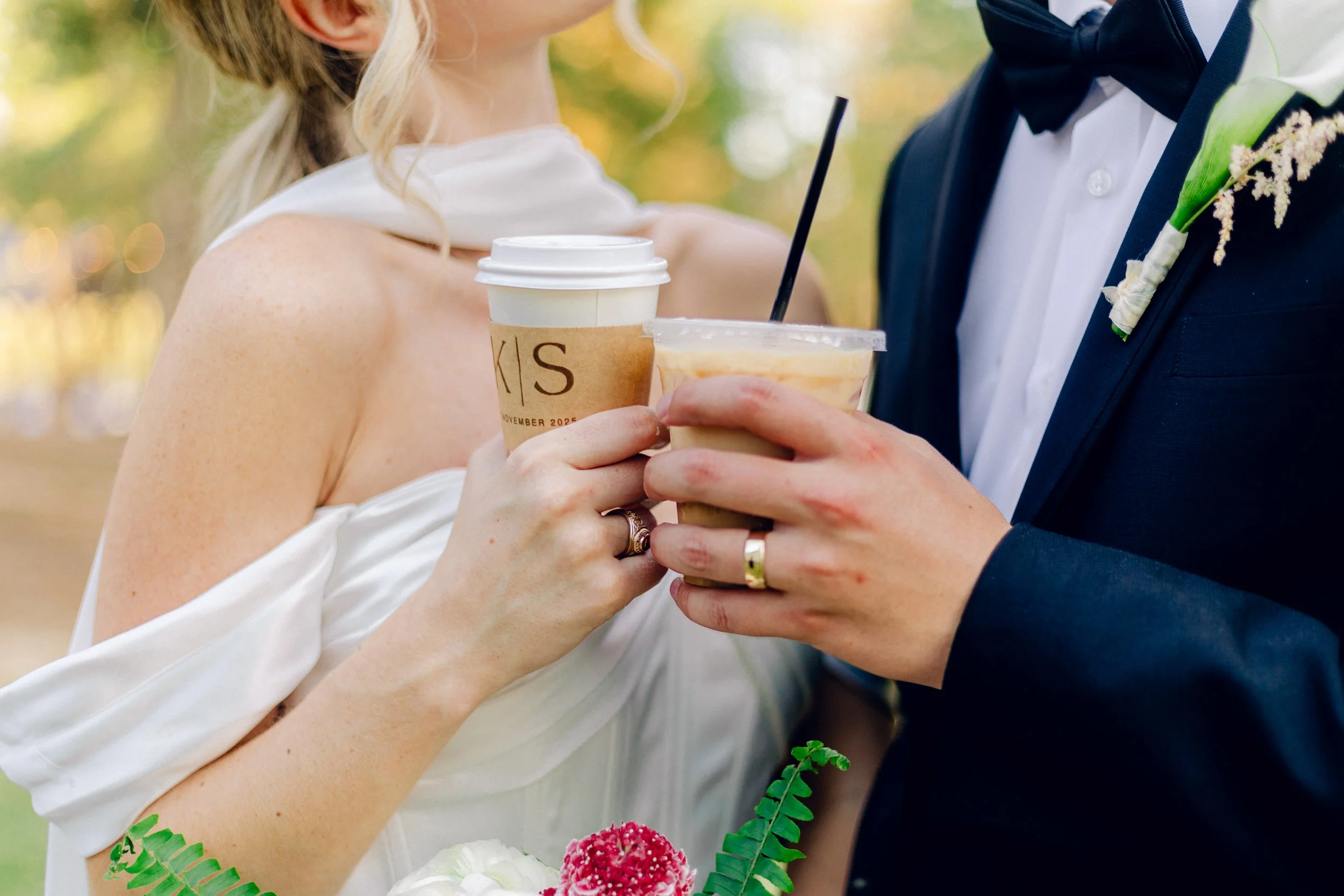 Wedding couple sharing coffee drinks from Bloom & Pour mobile coffee cart catering
