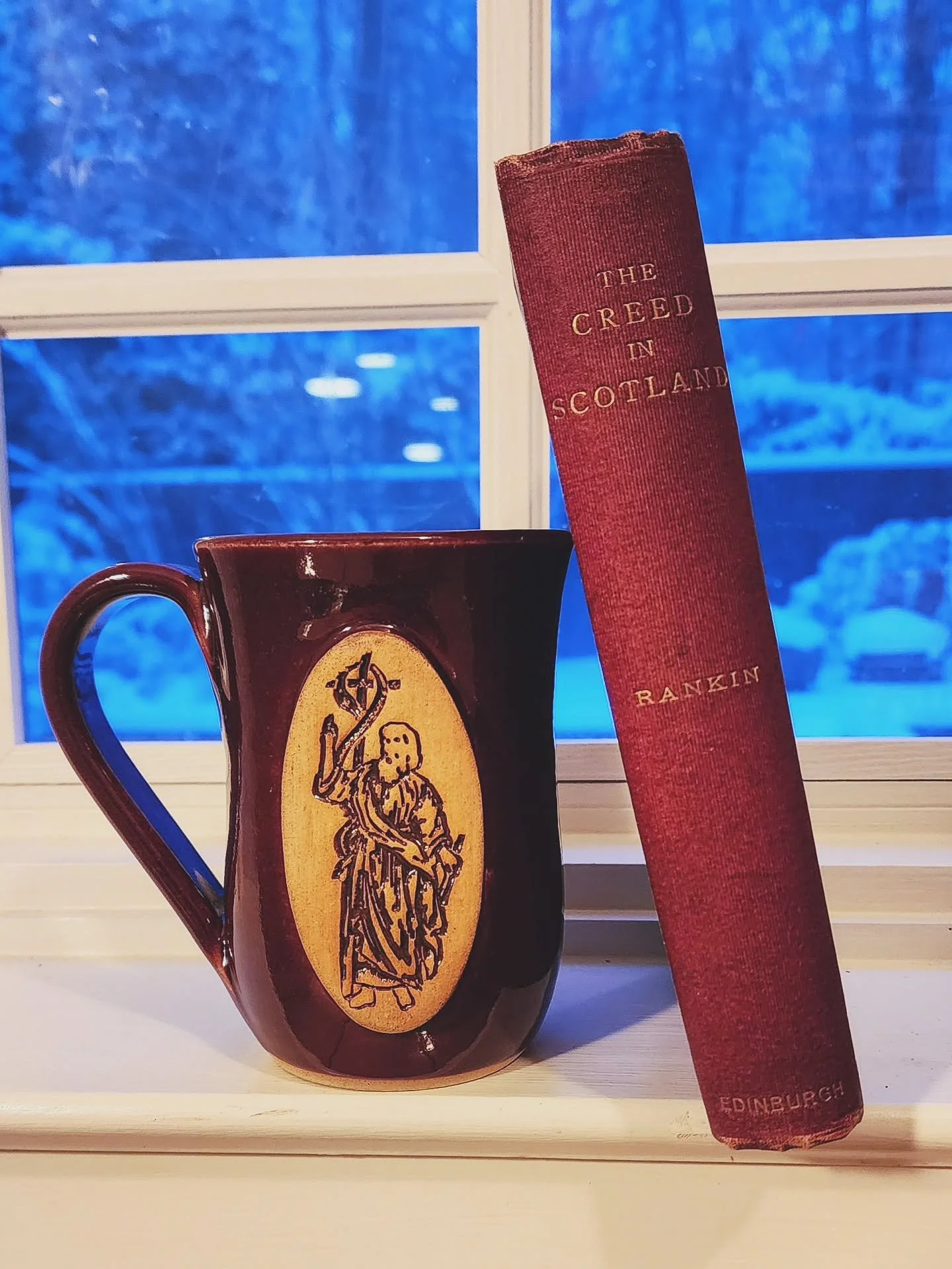 ❄️❄️❄️
A little #APCbooksandbrew on this (very) snowy day.

Our smaller, simplified 'We Preach Christ' handmade pottery mug paired with the 1890 volume 'The Creed in Scotland: An Exposition of the Apostles' Creed' by James Rankin.
.
.
.
.
. 
#APilgri