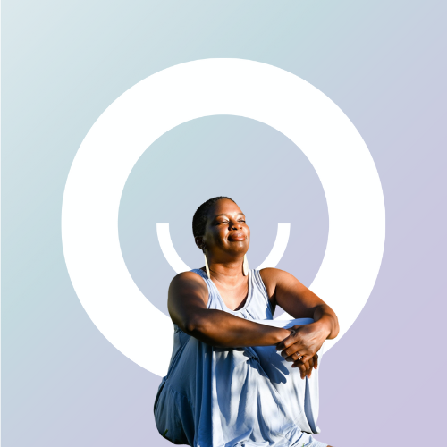 There's a picture of Tamisha in a light blue dress. She's sitting with her eyes closed and smiling. The company logo is white behind her.