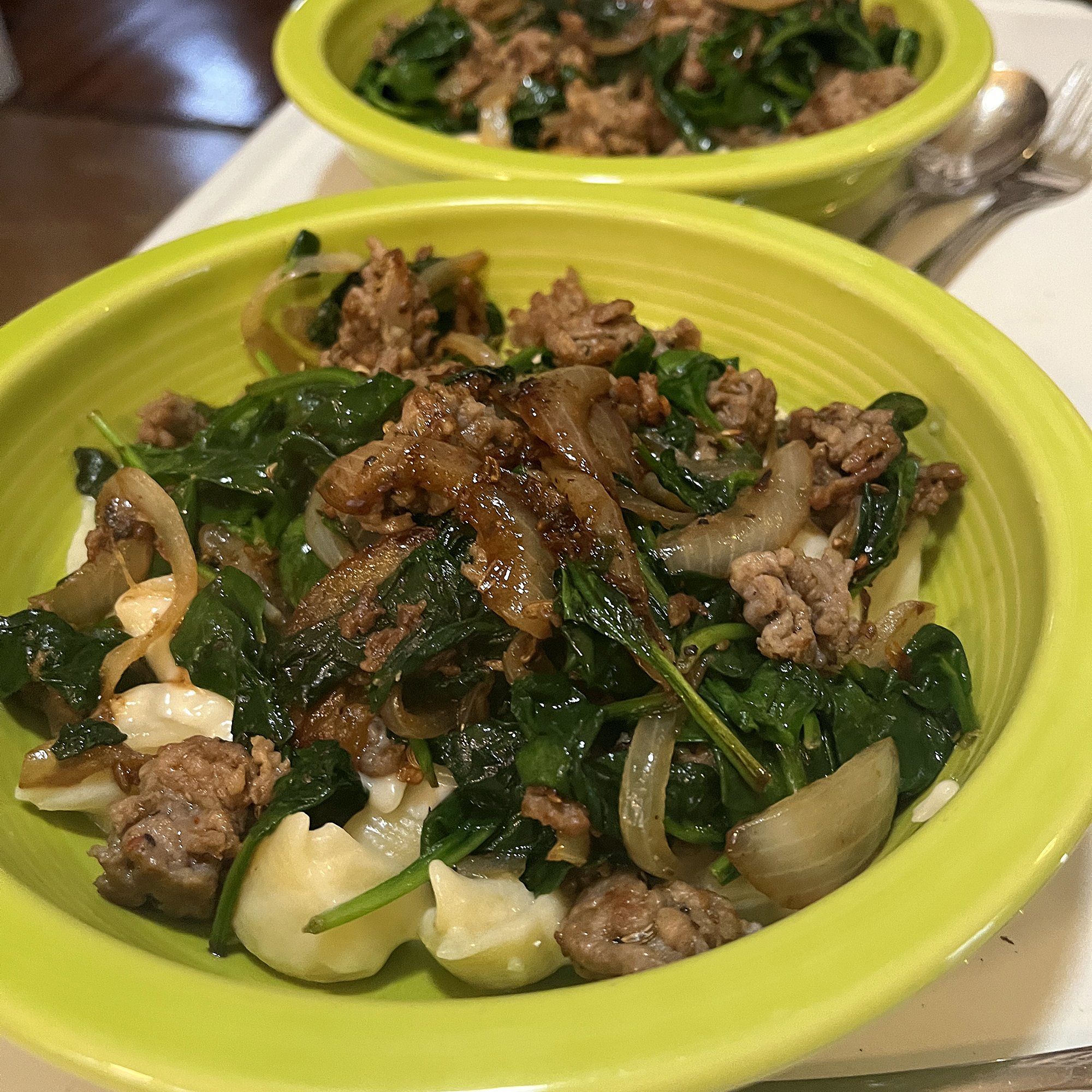 Top with sausage-spinach mixture and serve.  