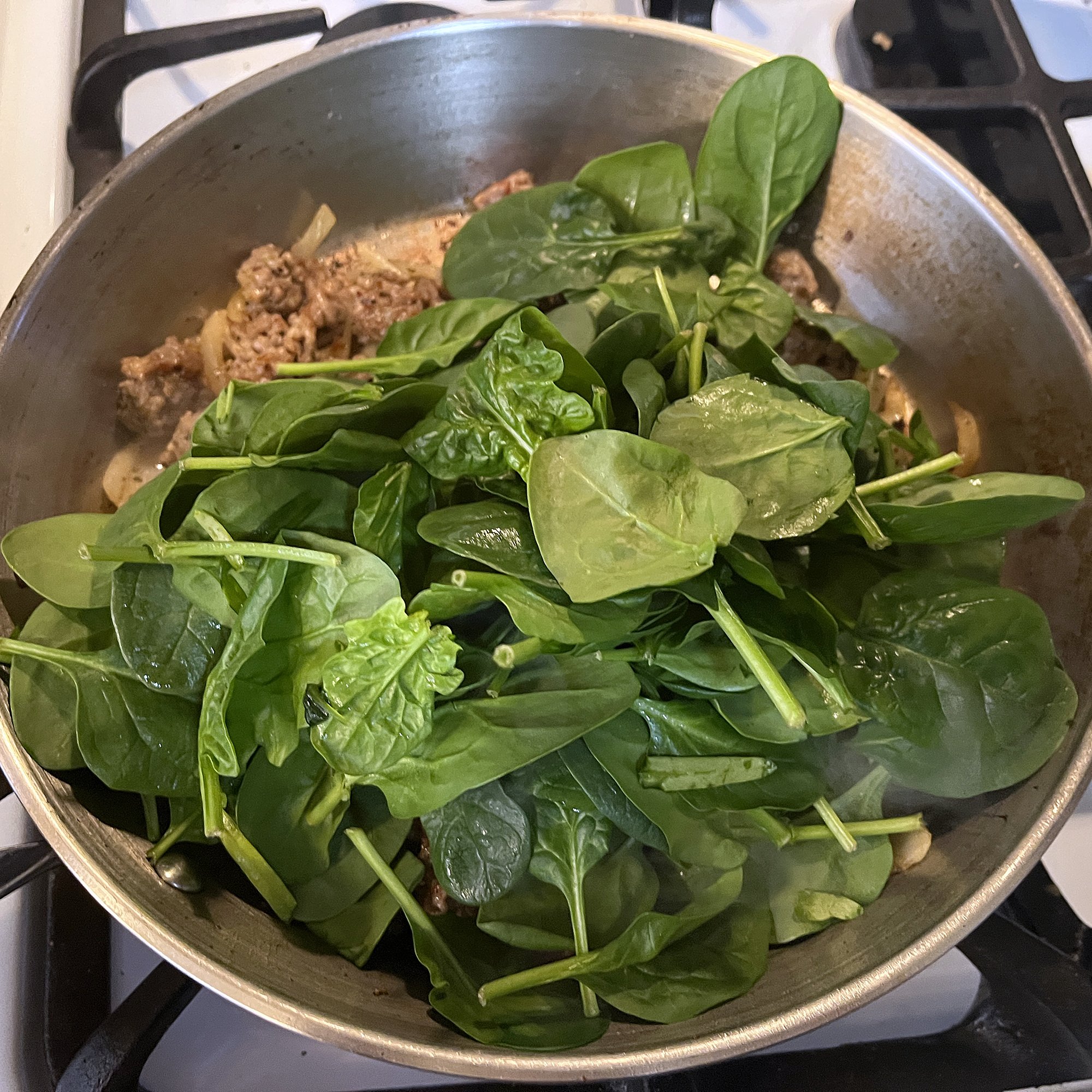 Reduce heat and add spinach.