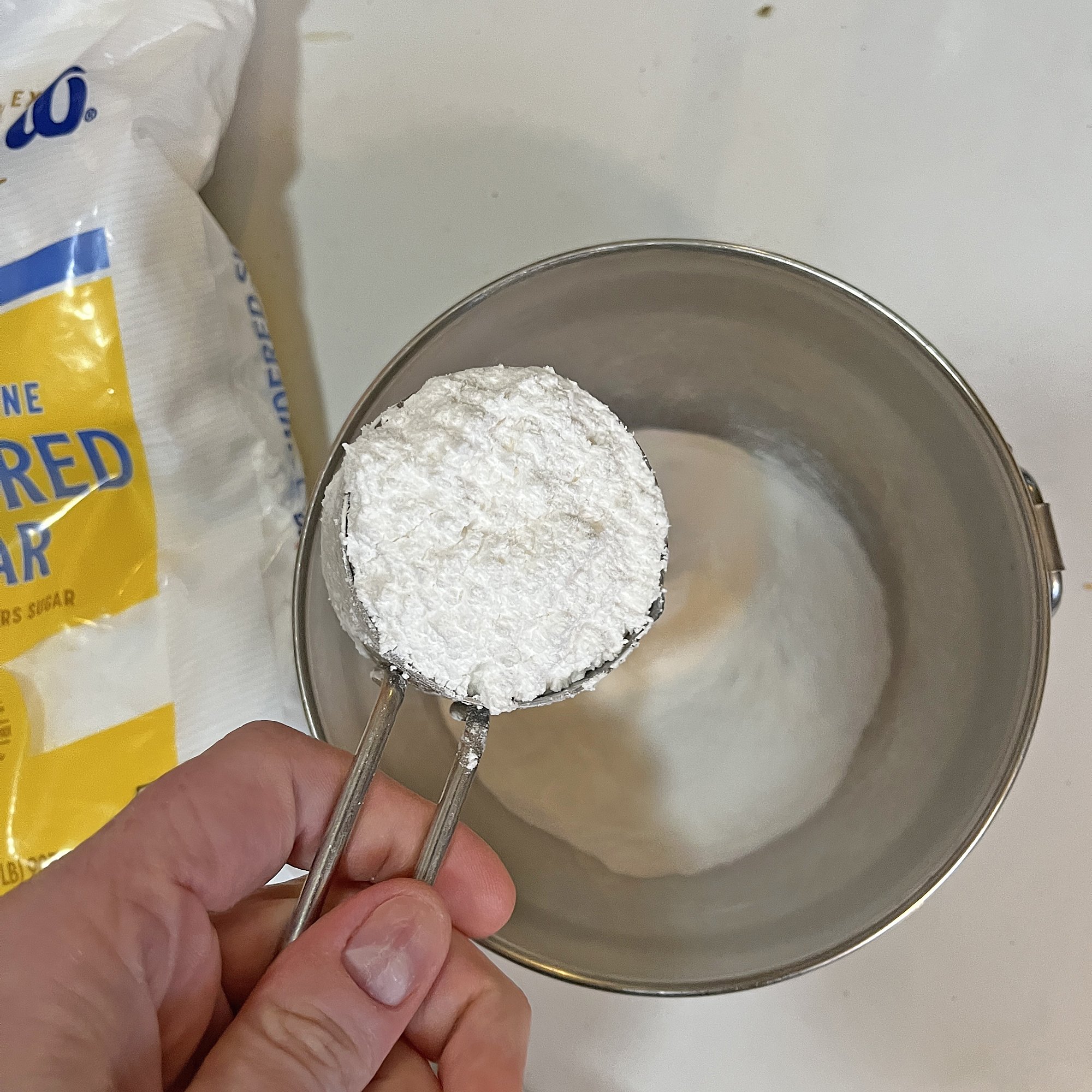 Measure out equal parts baking soda &amp; powdered sugar. I used 1/4 cup each.