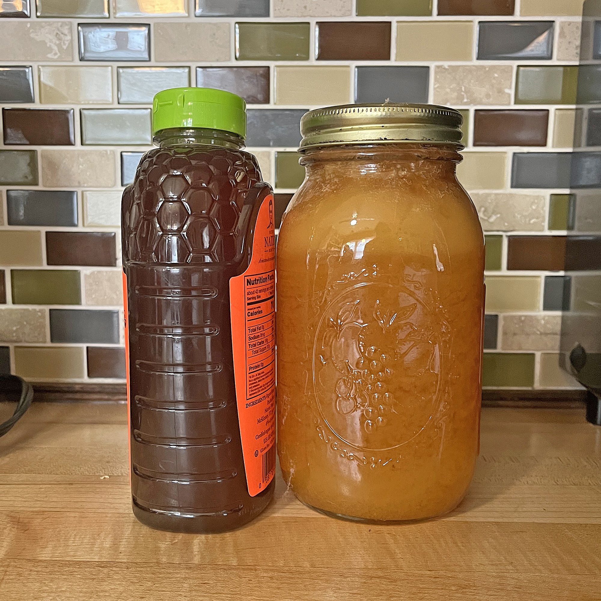 Both are raw unfiltered honey, but what's in the Ball jar is so crystalized, it's almost solid.