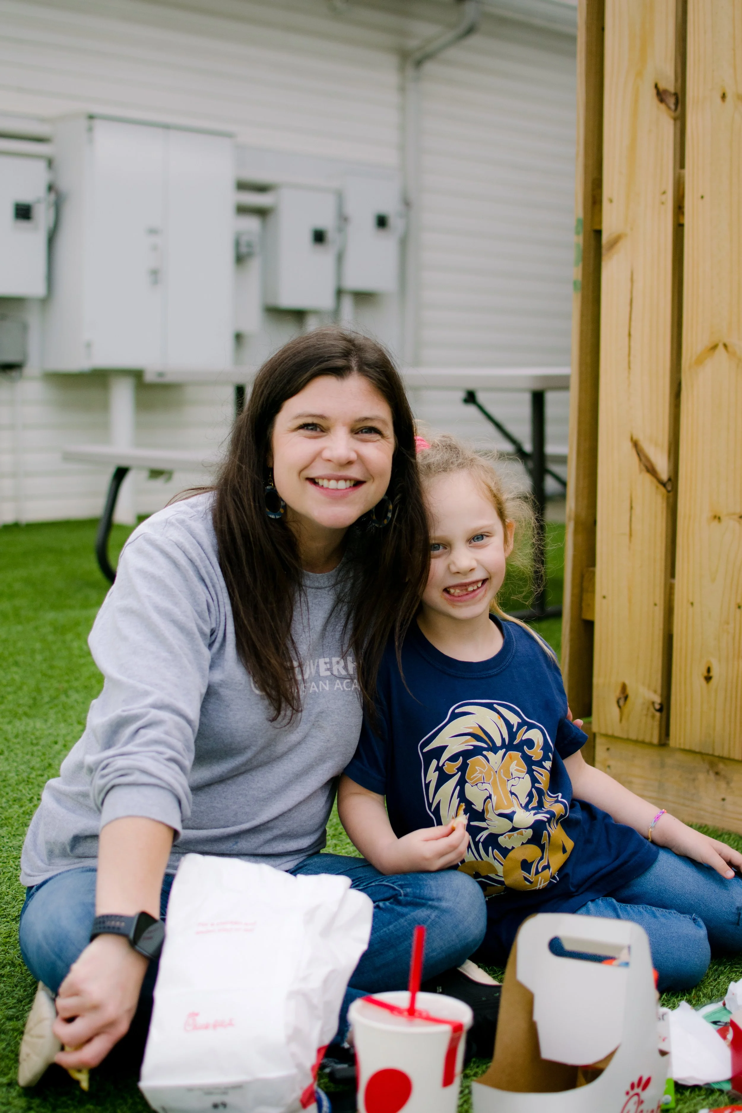 Moma and daughter sit in yard at private Christian school in Midlothian, in Chesterfield County Virginia