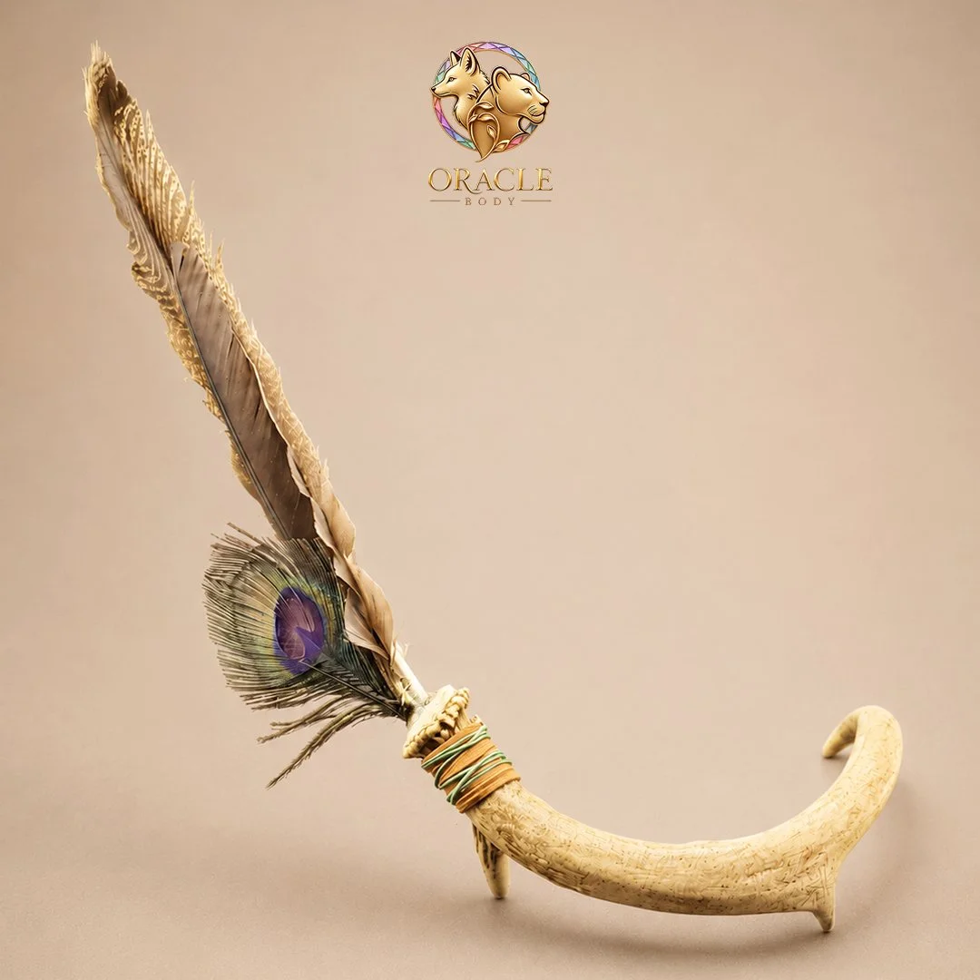 The Mystic Crescent peacock feather wand on curved deer antler handle with light background.jpg