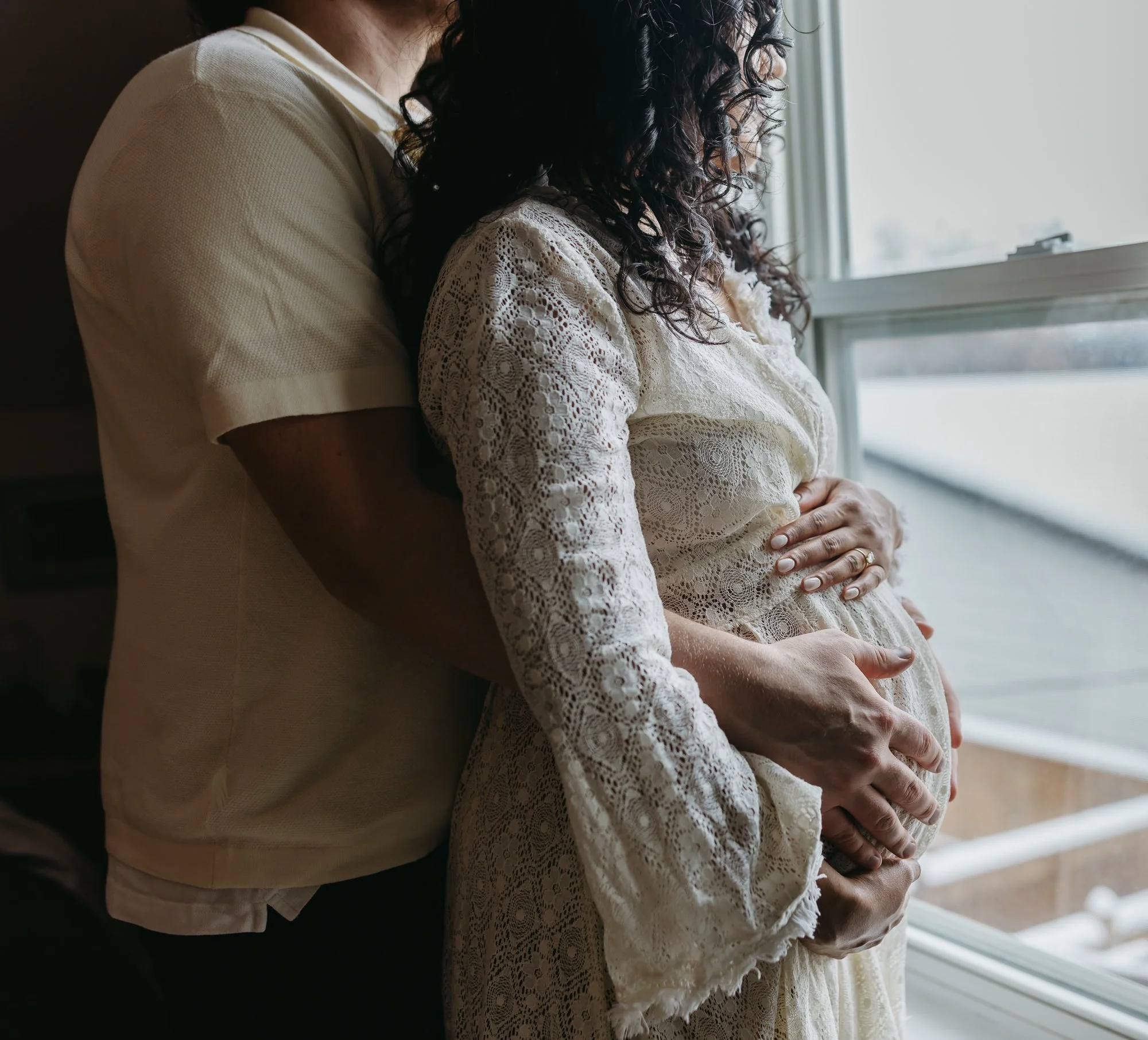 Couple at home maternity session in Calgary