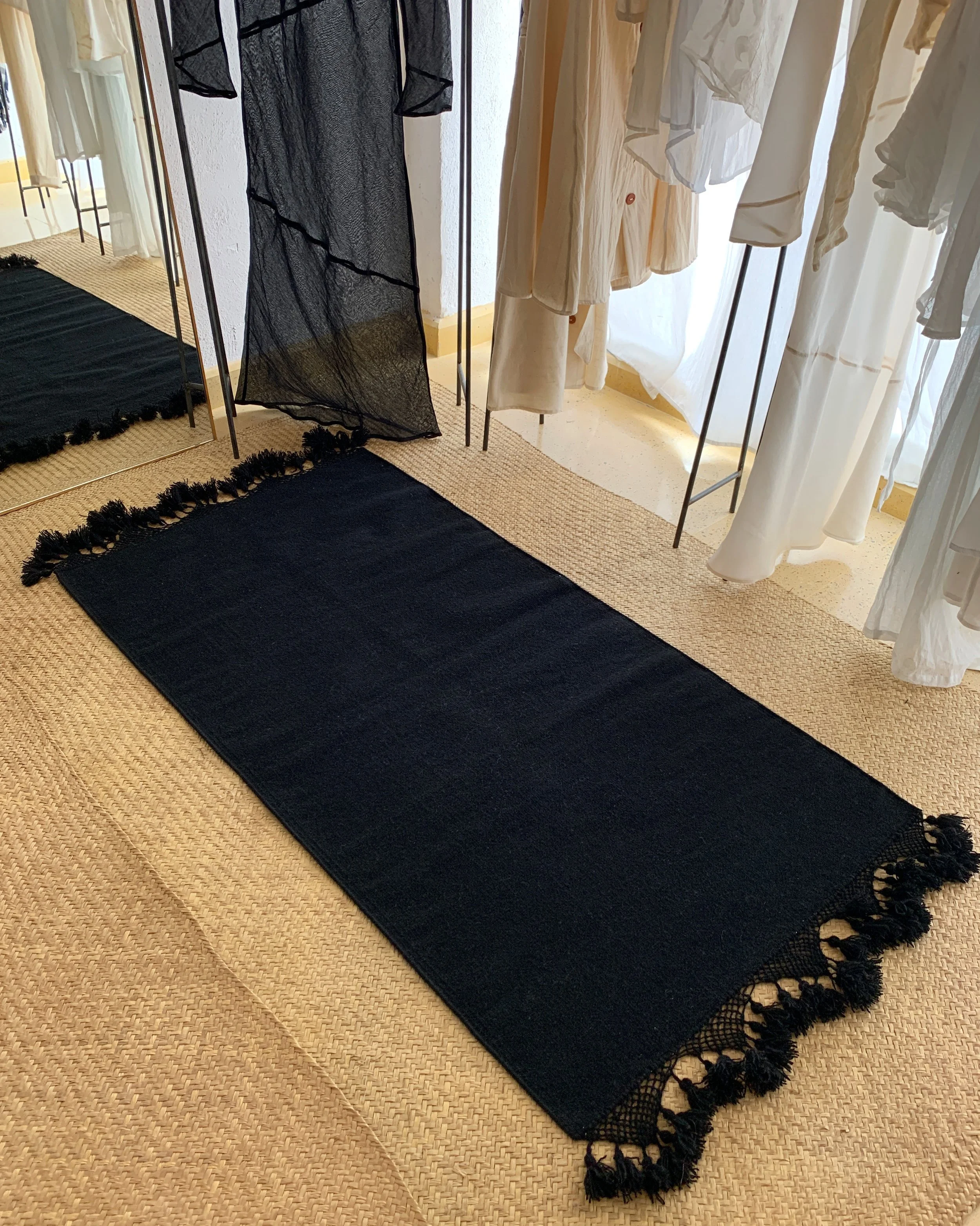 Mexchic handwoven wool rug with natural dyes and pom pom fringe made in teotitlan del valle oaxaca, the best shopping in oaxaca, guide clothing homewares boho tulum style contemporary Mexican design