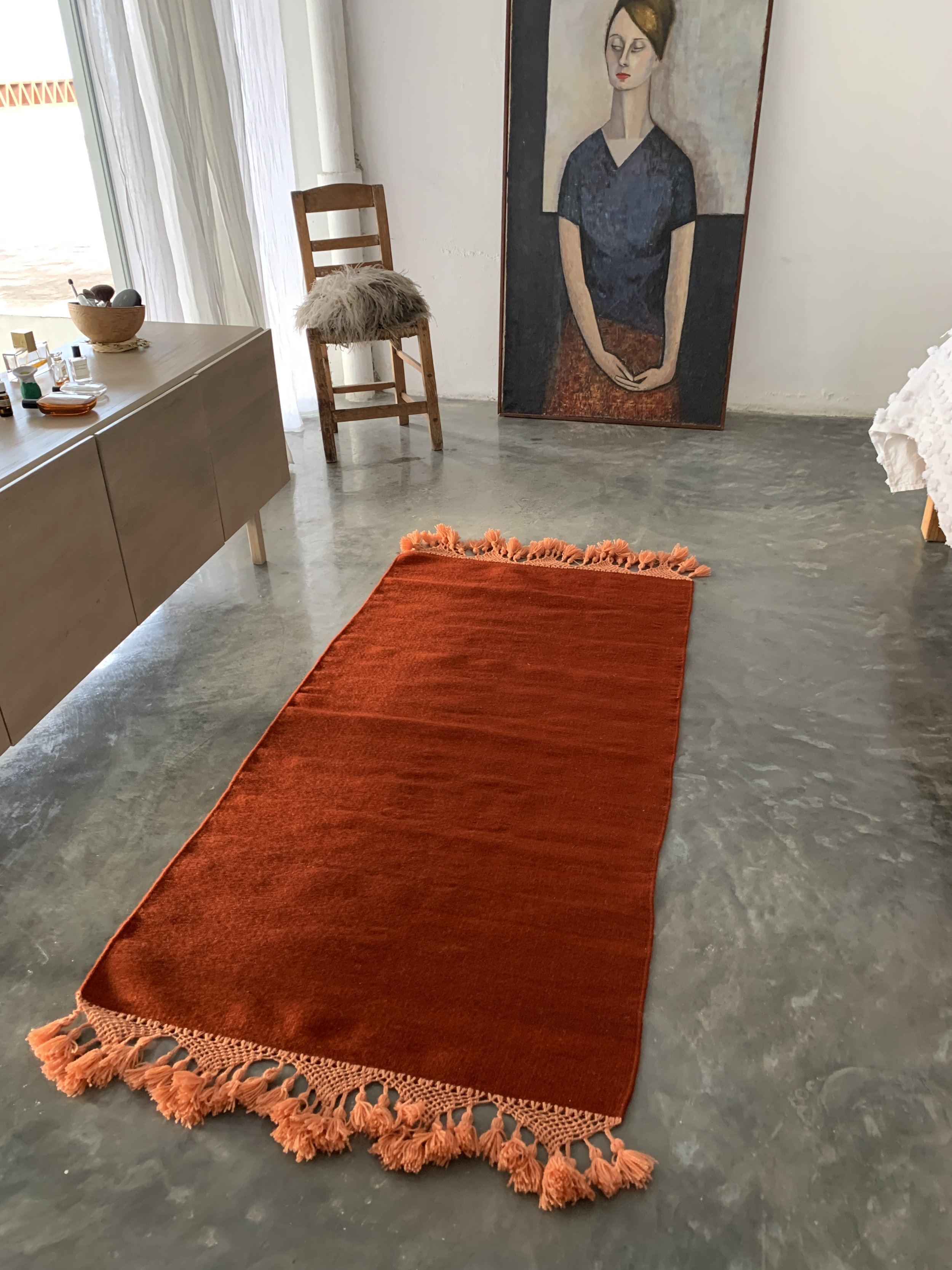 Mexchic handwoven wool rug with natural dyes and pom pom fringe made in teotitlan del valle oaxaca, the best shopping in oaxaca, guide clothing homewares boho tulum style contemporary Mexican design