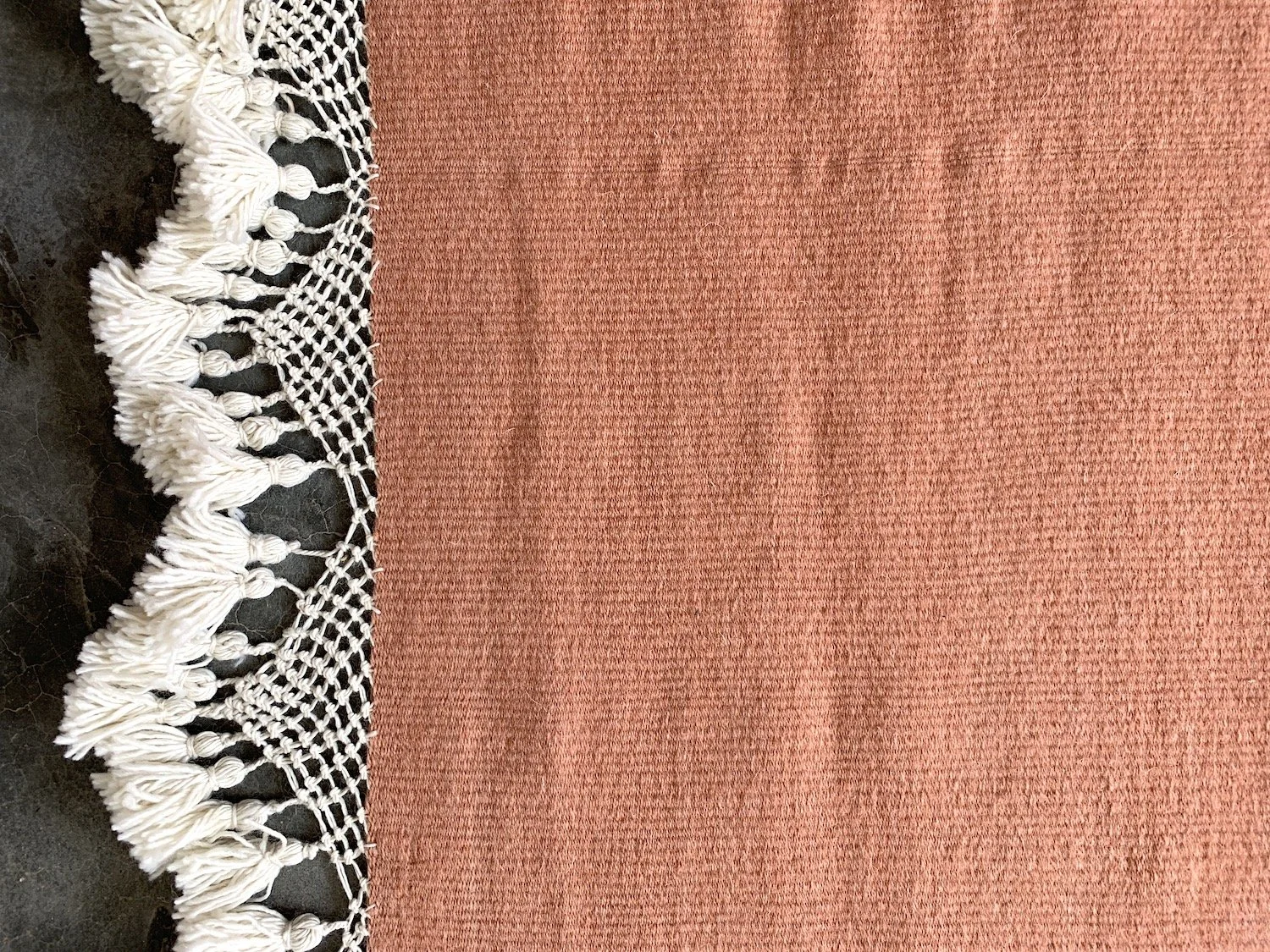 Mexchic handwoven wool rug with natural dyes and pom pom fringe made in teotitlan del valle oaxaca, the best shopping in oaxaca, guide clothing homewares boho tulum style contemporary Mexican design