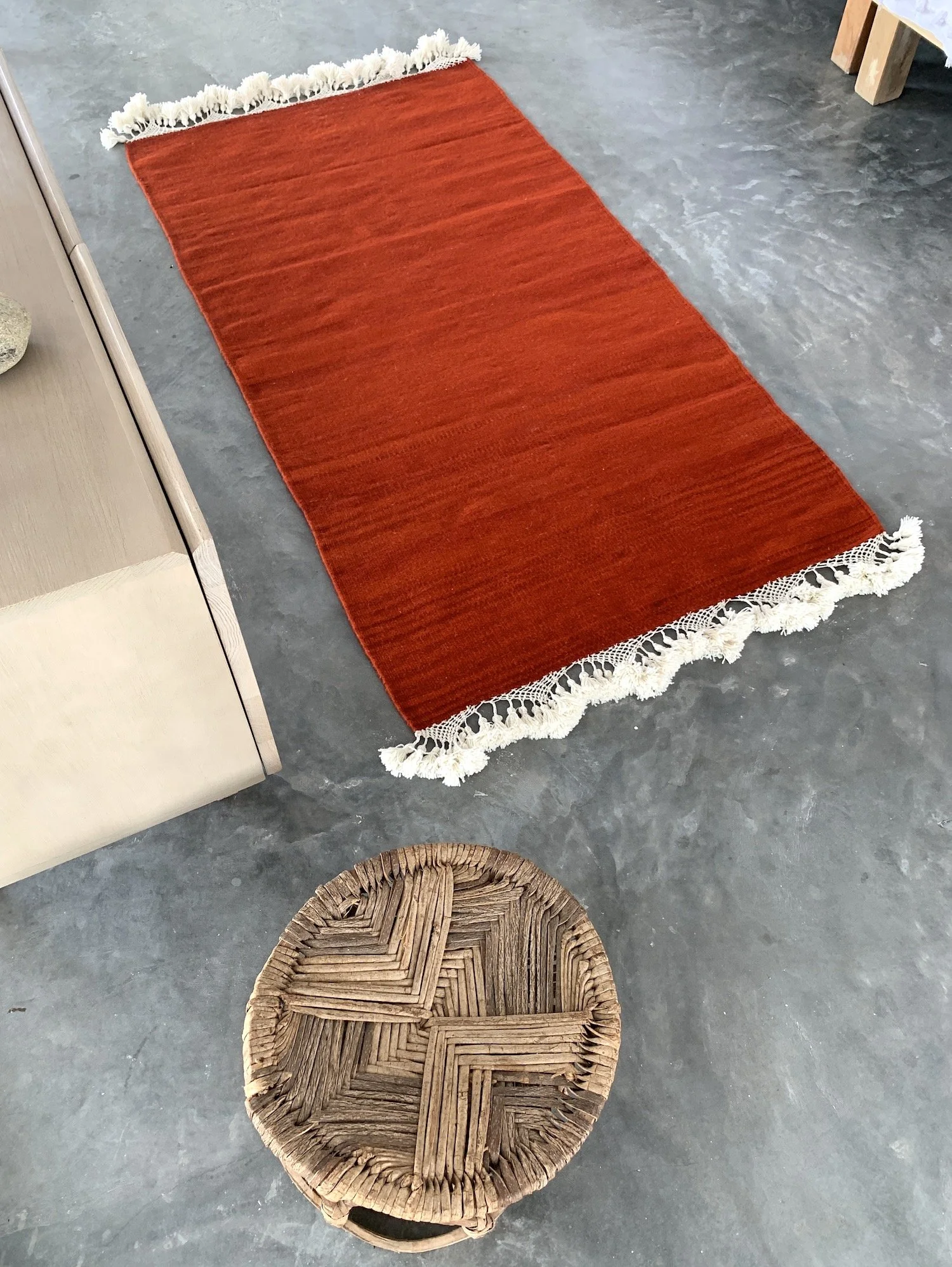 Mexchic handwoven wool rug with natural dyes and pom pom fringe made in teotitlan del valle oaxaca, the best shopping in oaxaca, guide clothing homewares boho tulum style contemporary Mexican design