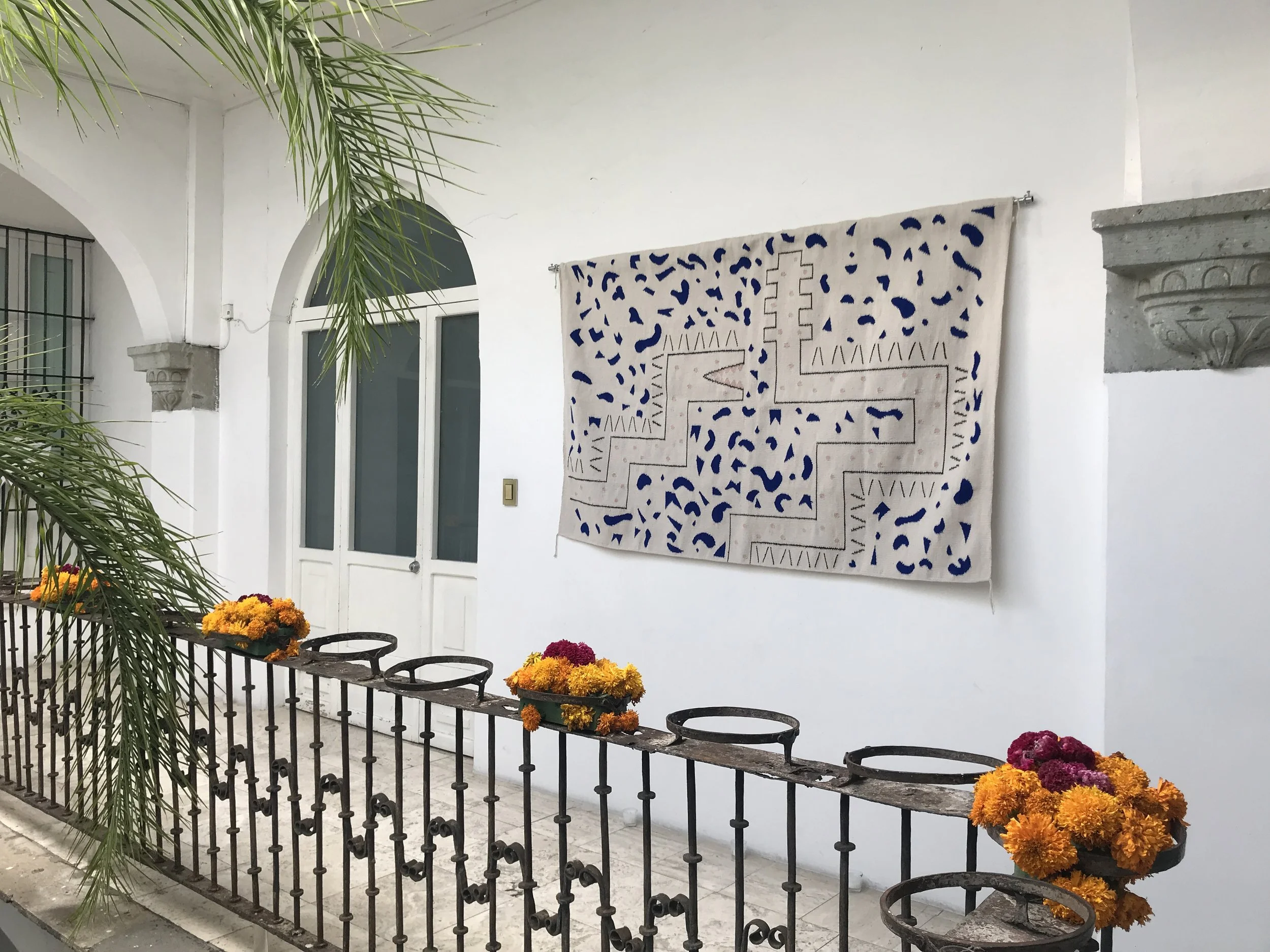 Mexchic rug hand woven wool textile artisan made tapestry art Mexican design contemporary craft serpent snake Quetzalcoatl plumed serpent keith haring pop art atari oaxaca shopping