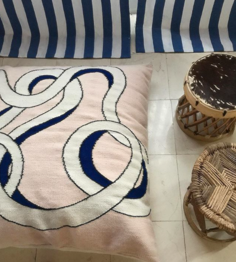 Mexchic handwoven floor pillow curvy loops pink blue cream contemporary craft Quetzalcoatl plumed serpent Oaxaca teotitlan del valle Mexican design