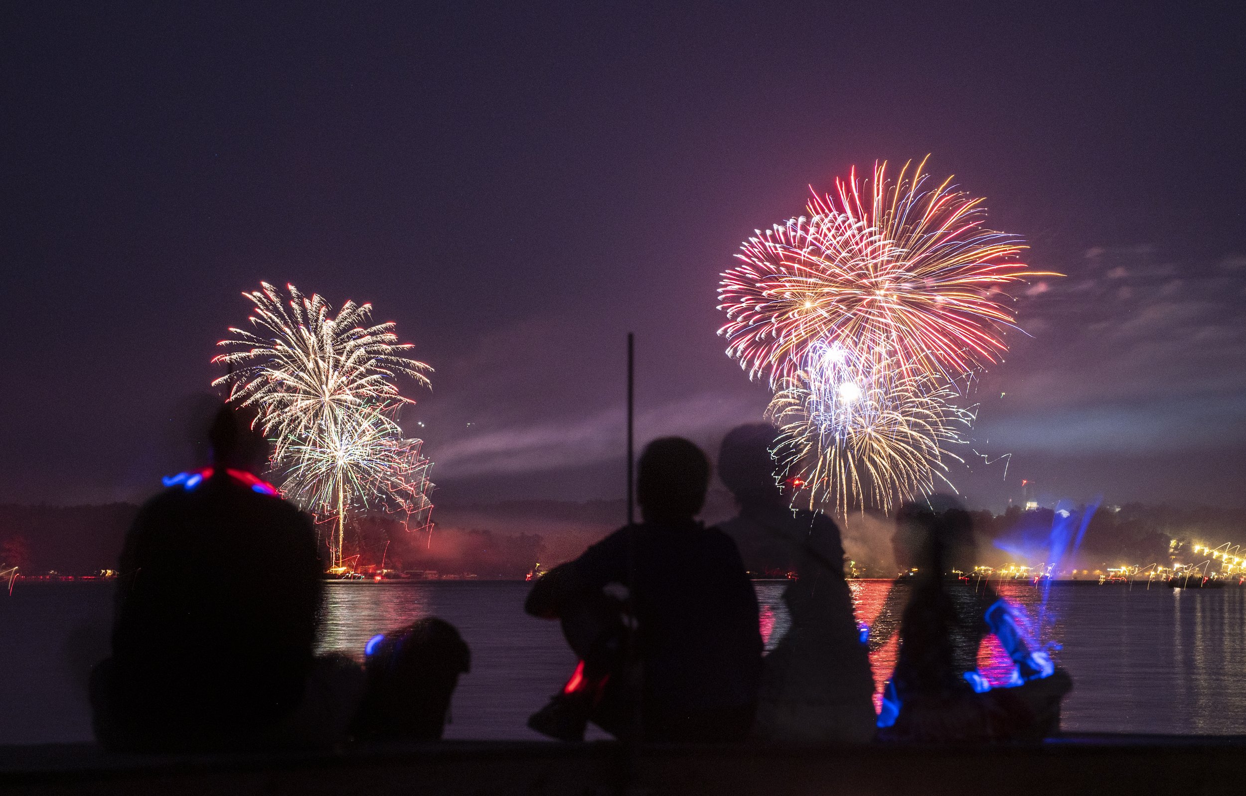 Chautauquans watch fireworks on July 4, 2022 from the docks near the Miller Bell Tower at the Chautauquan Institute.