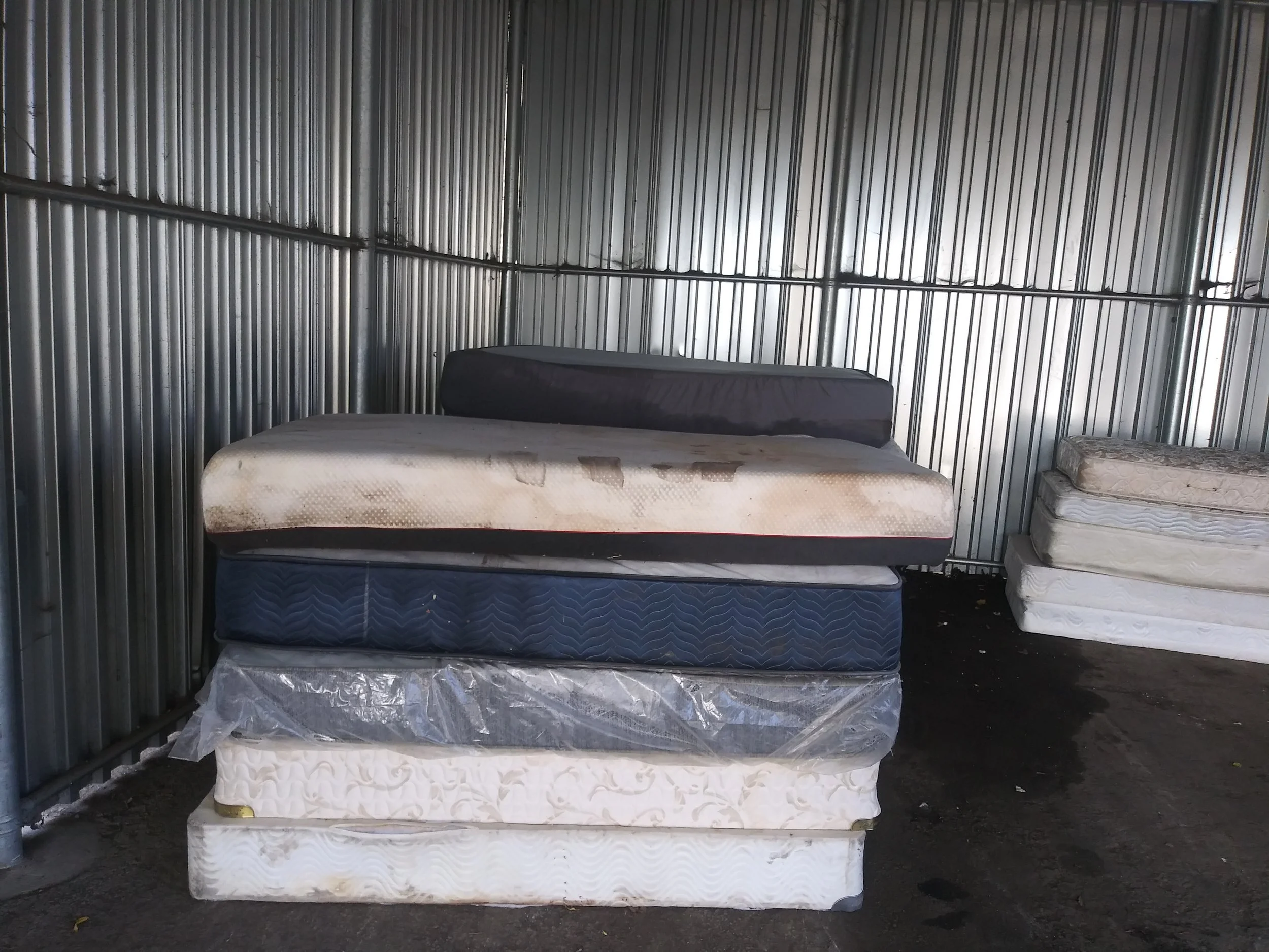 Used mattresses stacked for junk hauling and responsible disposal service.
Mattress removal and junk hauling service for residential cleanouts.
"Old bed mattresses being hauled away .