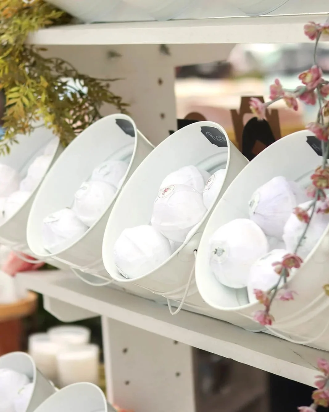 white buckets of bath bombs