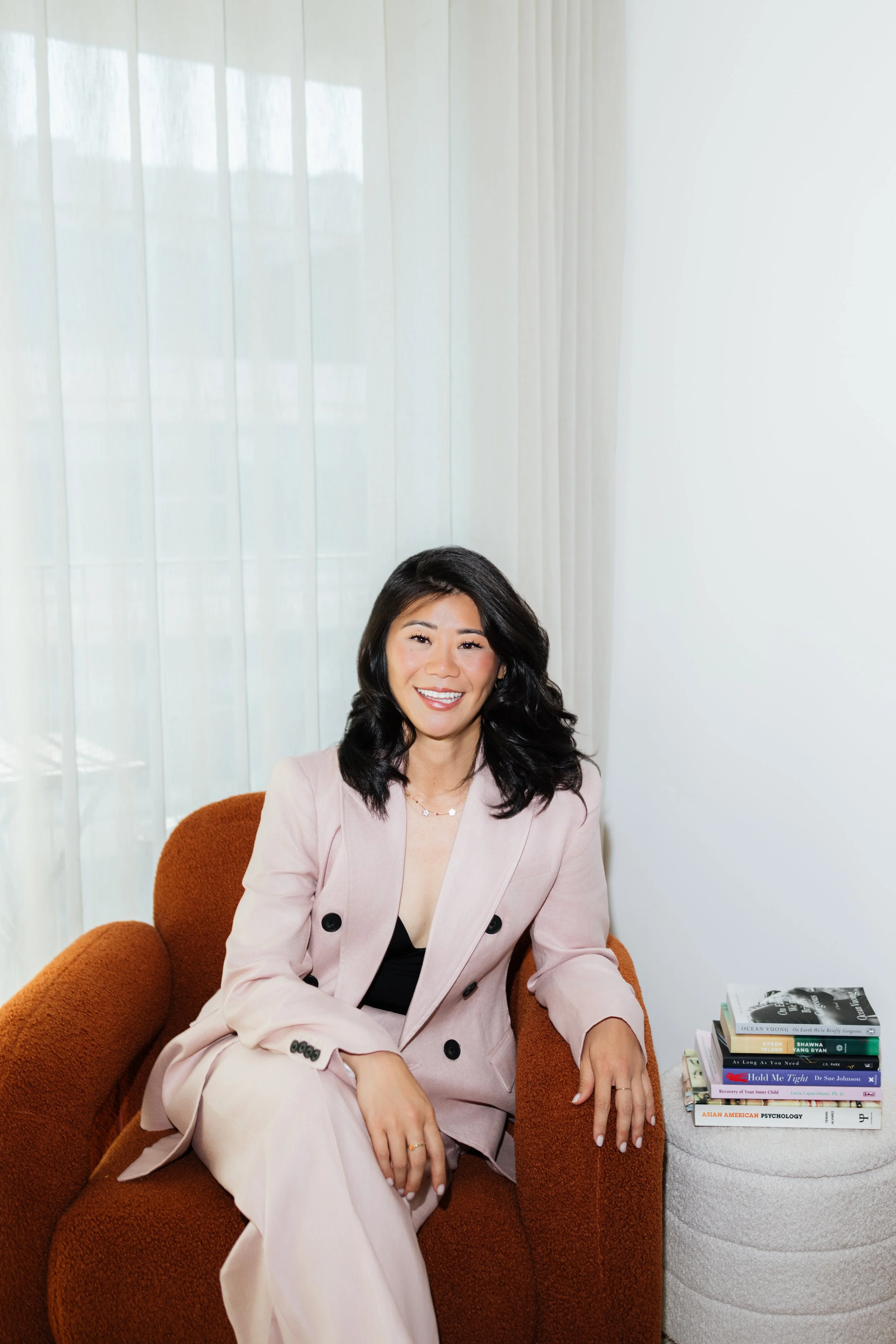 Asian American therapist providing culturally responsive therapy online