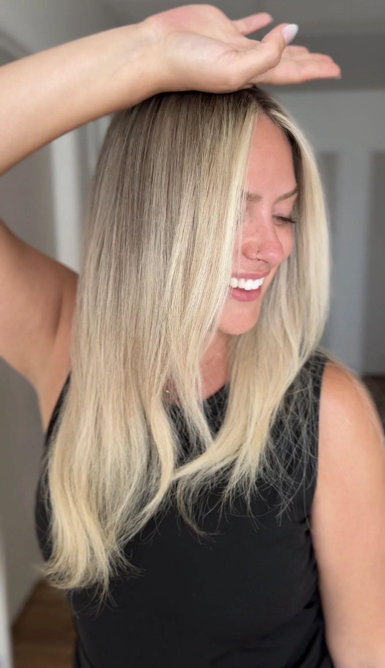 Bright lived-in blonde with a soft, blended root by Sarah Huff in Grand Haven, MI