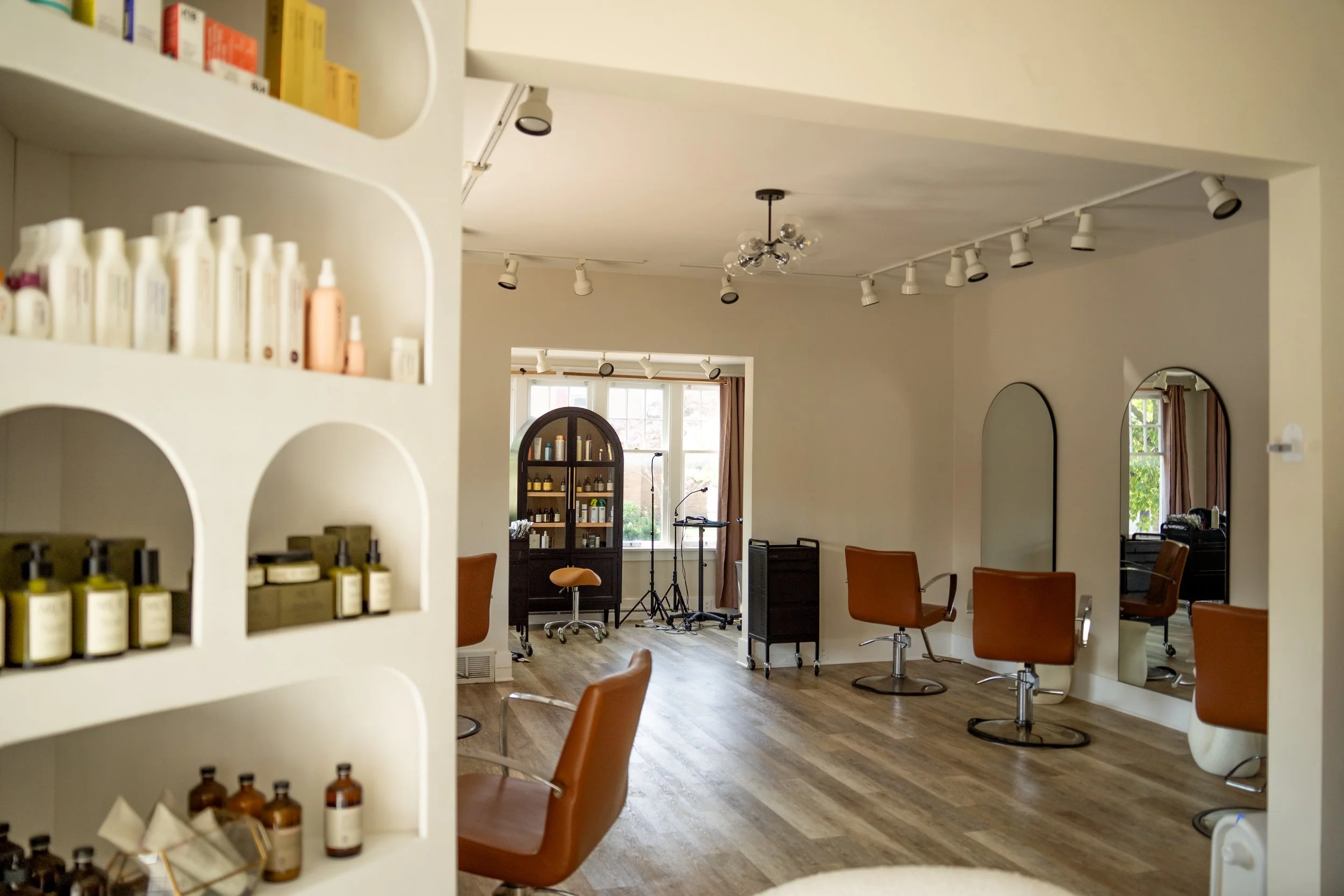 Luxury hair salon in Holland, MI with modern styling chairs and a spa-like atmosphere. Ardor+Grit Salon specializes in blonding, extensions, and relaxation.
