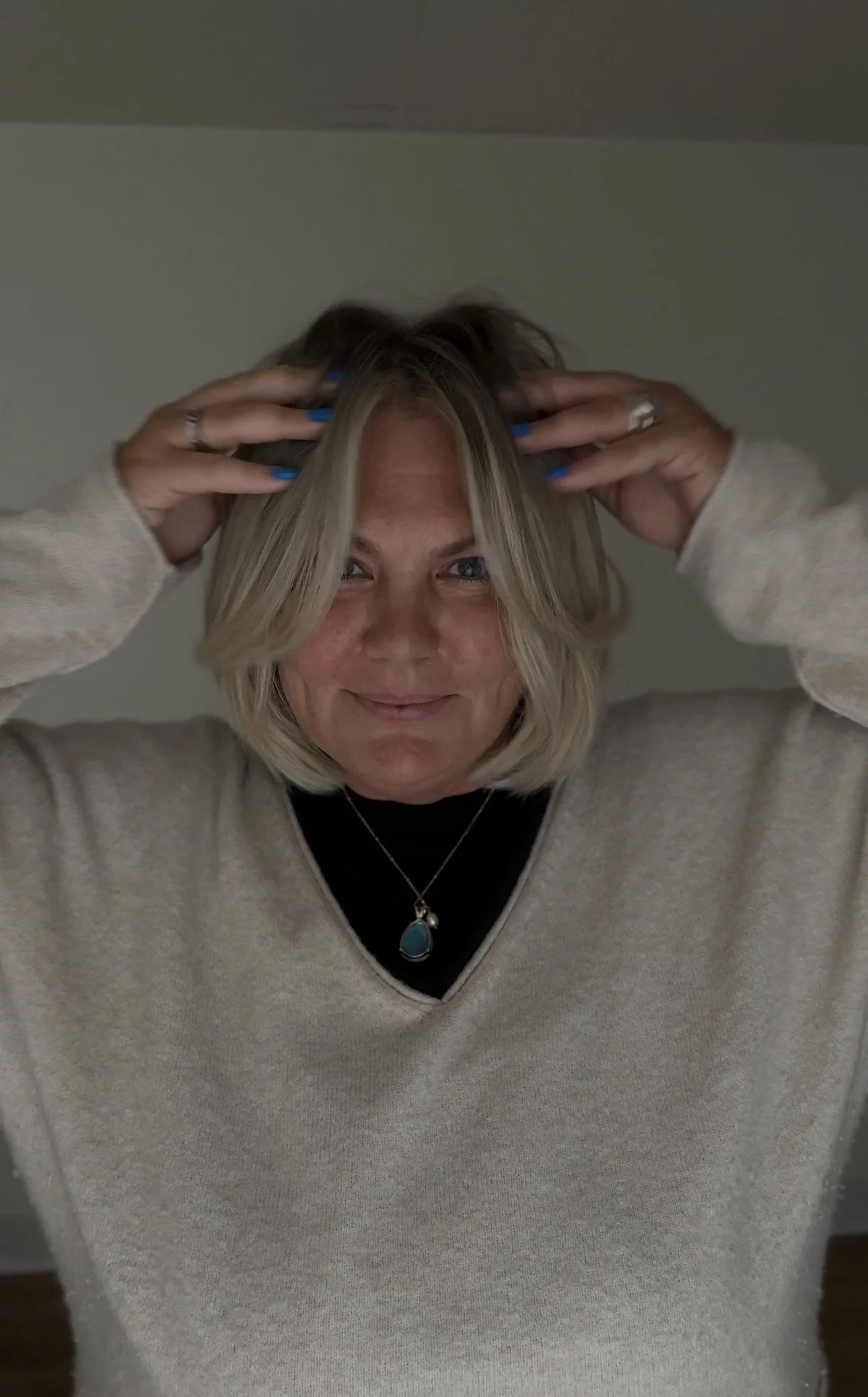 Soft blonde bob with a blended root by Sarah Huff in Grand Haven, MI