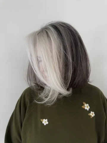 After Lakeshore Grey grey blending by Sarah Huff in Grand Haven, MI: bright silver face-framing blended into natural brunette and grey