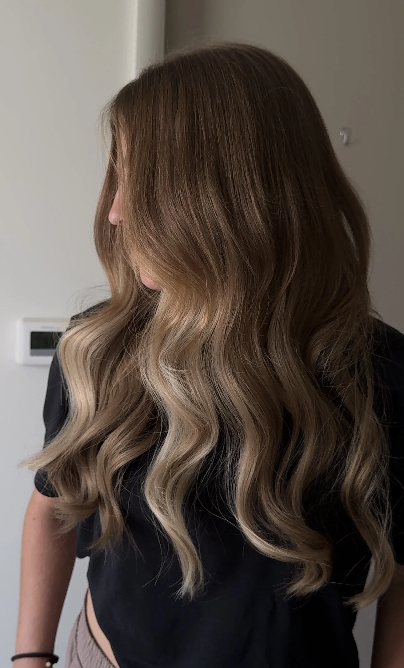 After seamless hair extensions by Sarah Huff in Grand Haven, MI: long, full, blended waves